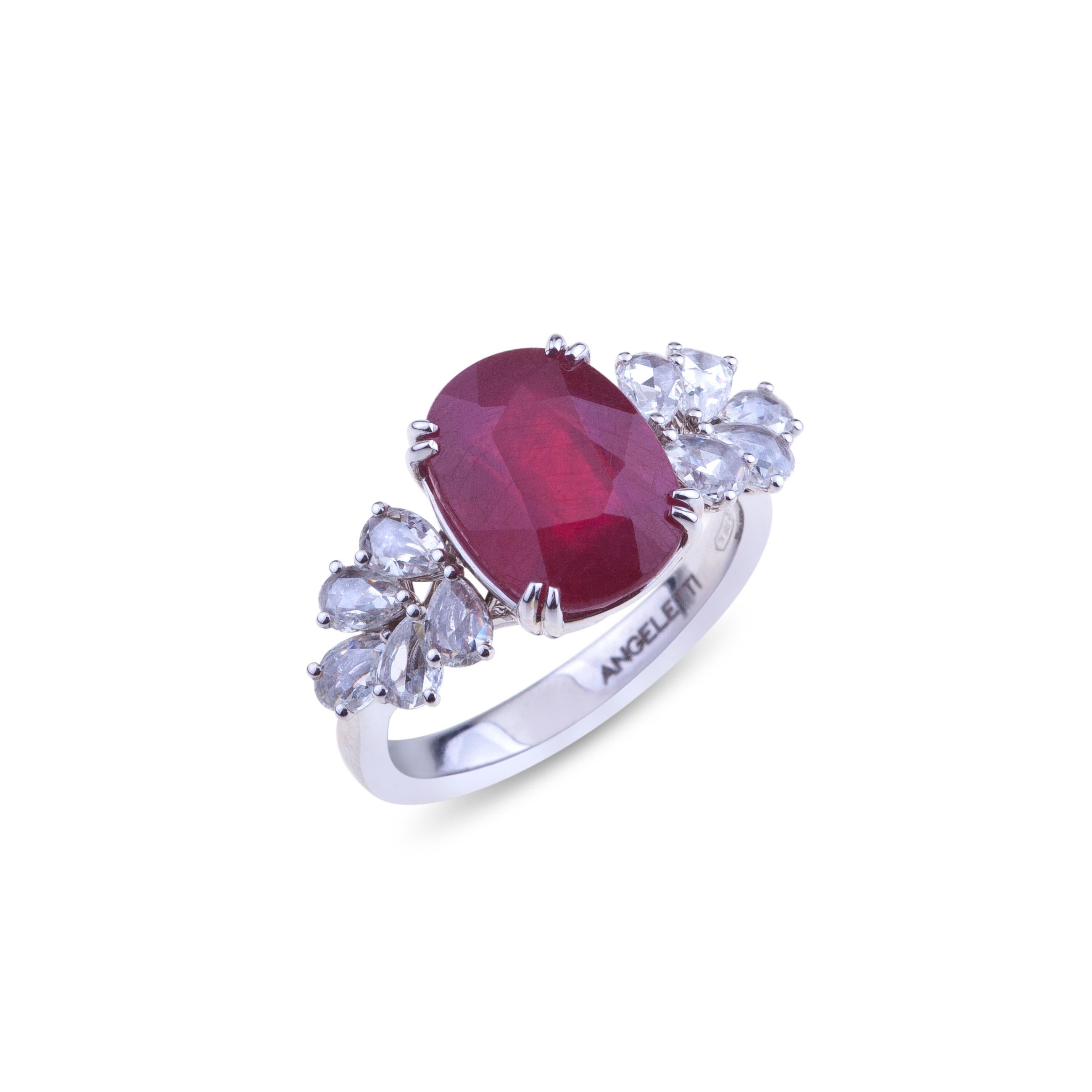 Antique Cut Ruby Ring set in White Gold with Diamonds.
An Antique Cut Ruby ct. 6.21 is set with White Gold and Pear Shape Diamonds ct. 0.83 VVS. The weight of the 18kt gold is gr. 5.48. The ruby is heated.
Designed in Italy. 
Angeletti Boasts an