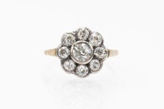 Bague marguerite ancienne avec diamants anciens de taille brillant 1.10ct