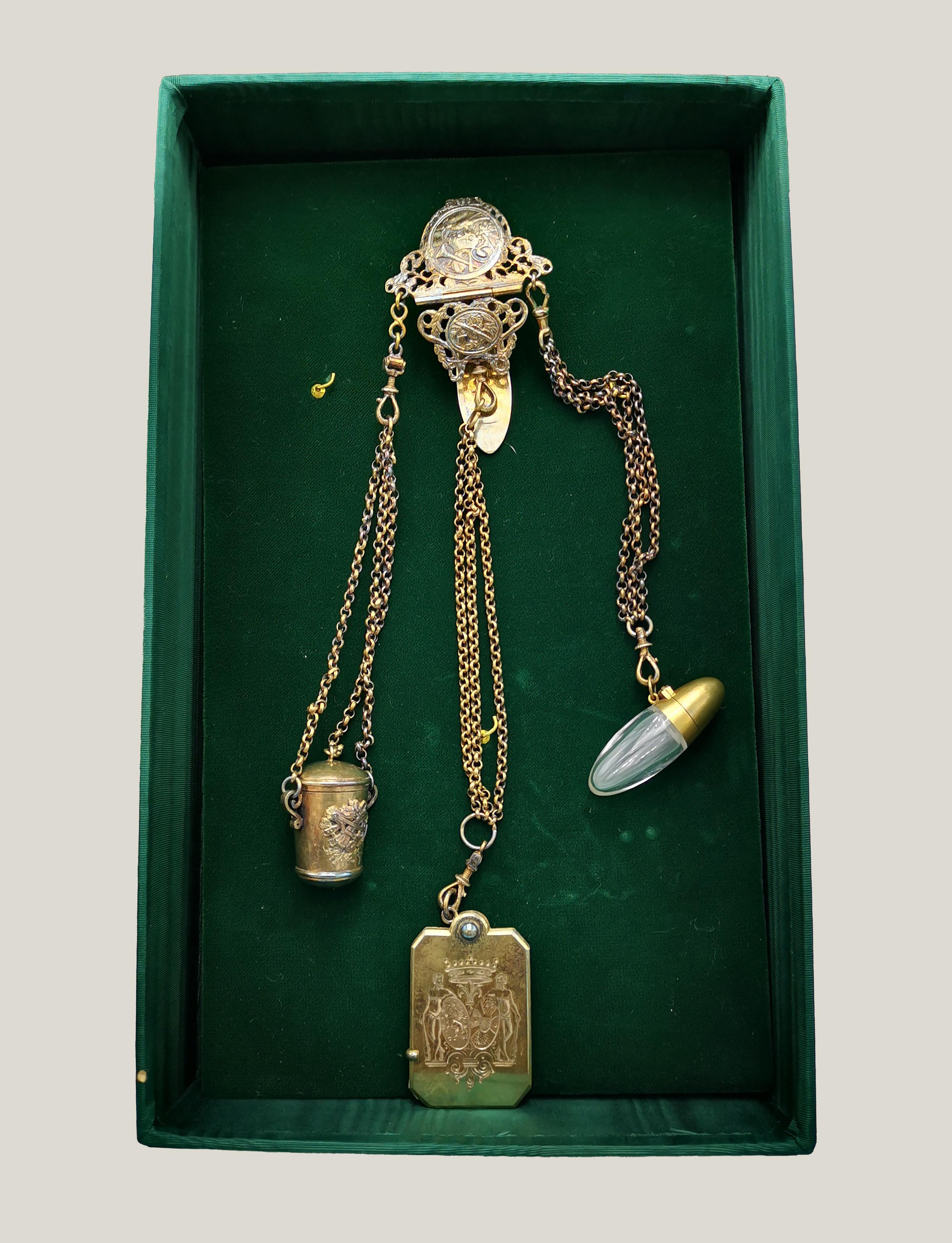 Antique dance chain is a precious decorative object realized in the 18th century.

Precious antique dance chain with decorations. Includes original green suitcase. 

In good conditions except of bluing of silver due to the time.