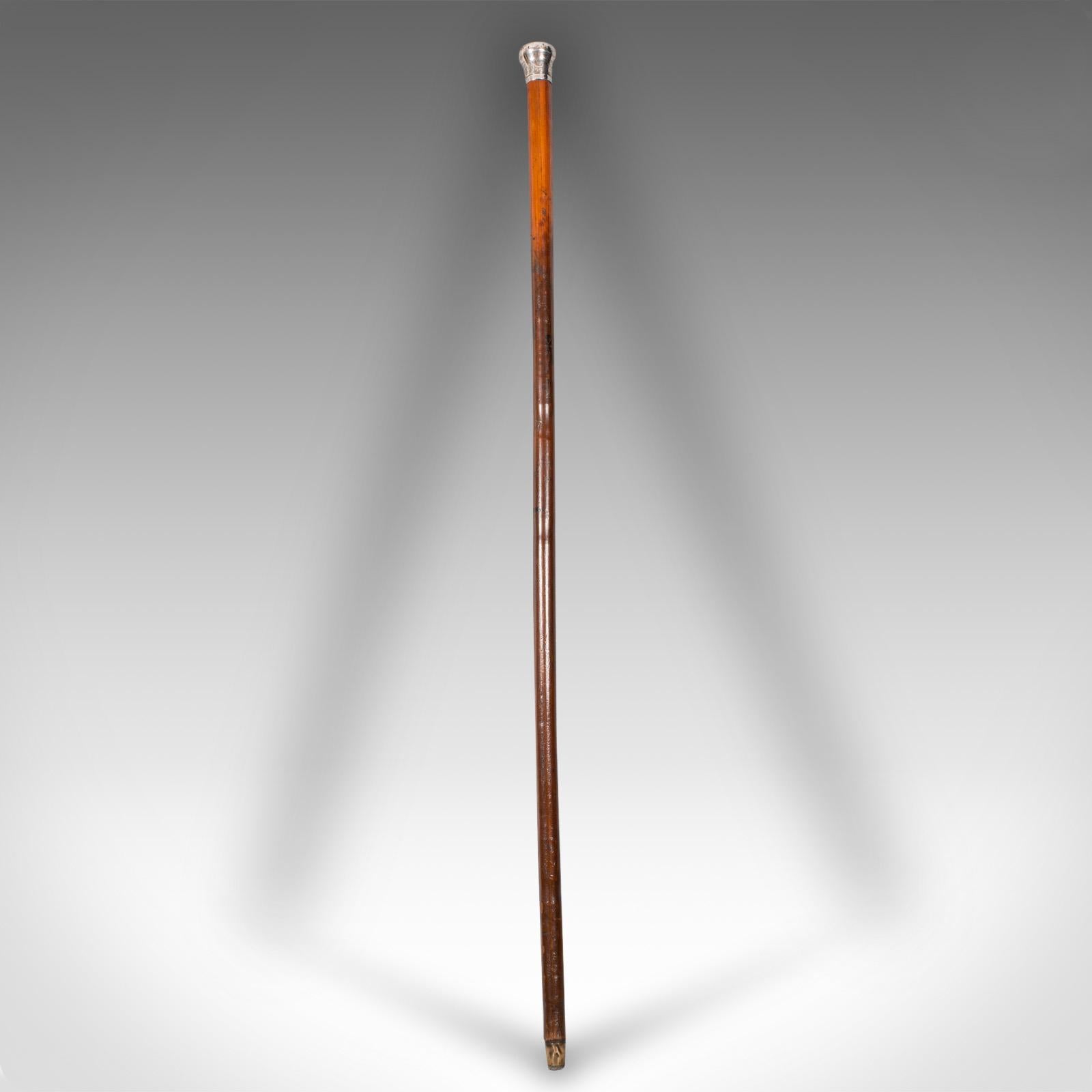 This is an antique dandy's walking cane. An English, fruitwood stick with hallmarked silver handle, dating to the late Victorian period, circa 1900.

Dashing gentleman's cane with delightful finish and appearance
Displays a desirable aged patina