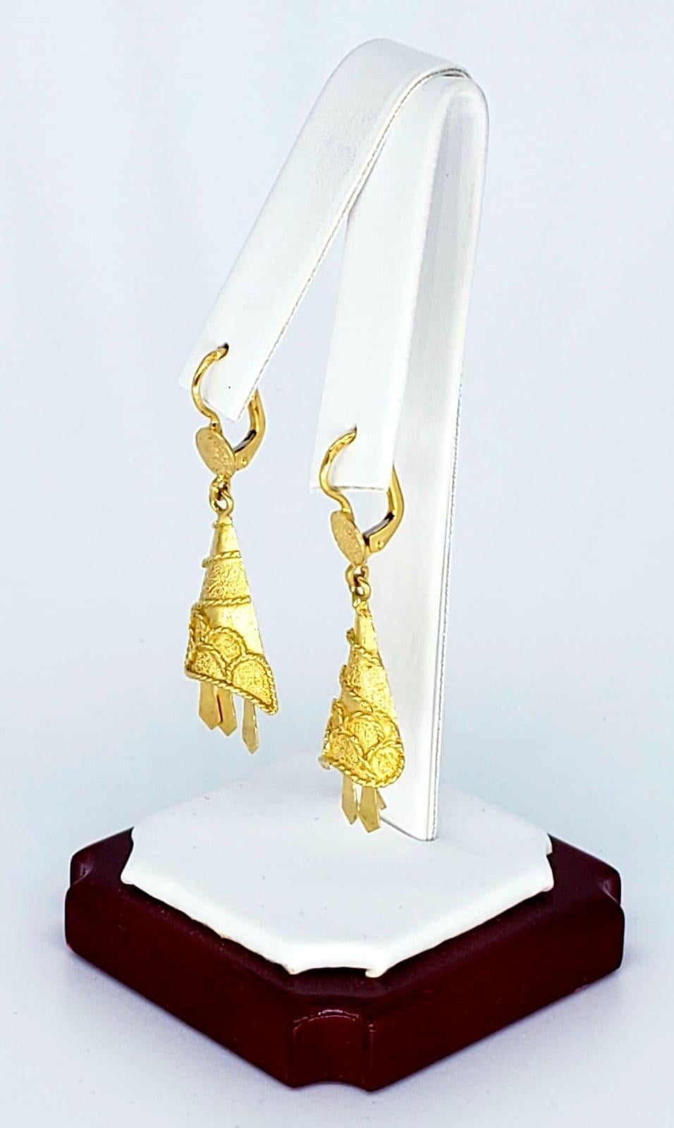 Antique Dangling Bell 18k Gold Earrings. The earrings are stamped 18k & Italy for country of manufacture. The earrings measure 12.6mm X 38.29mm and weight 6 grams 18k solid yellow gold. Circa 1910
