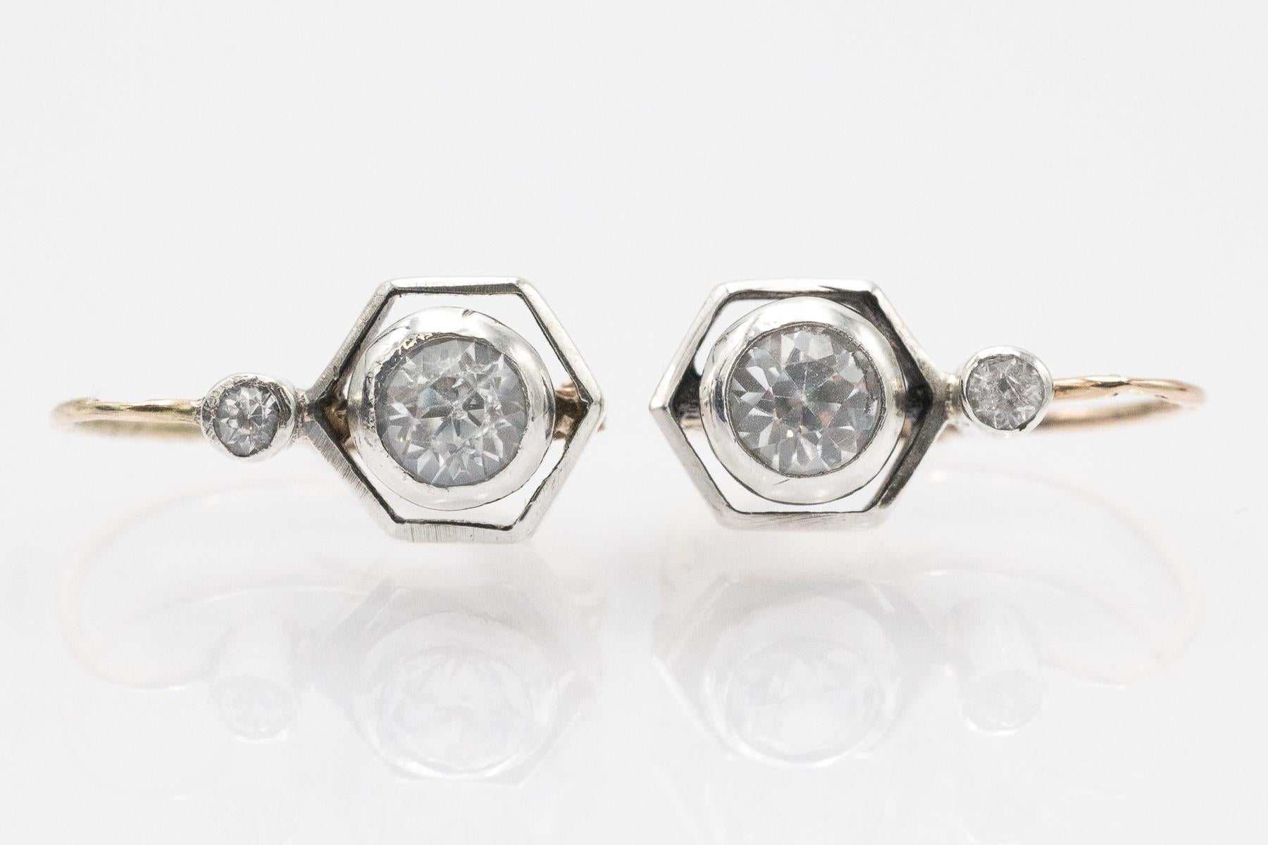 Beautiful, antique gold and silver earrings with leucosapphires (white sapphires) weighing approximately 1.00 carats.

The earrings are crafted from 14k yellow gold and 0.950-0.990 fine silver.

Origin: Austria-Hungary, first half of the 20th