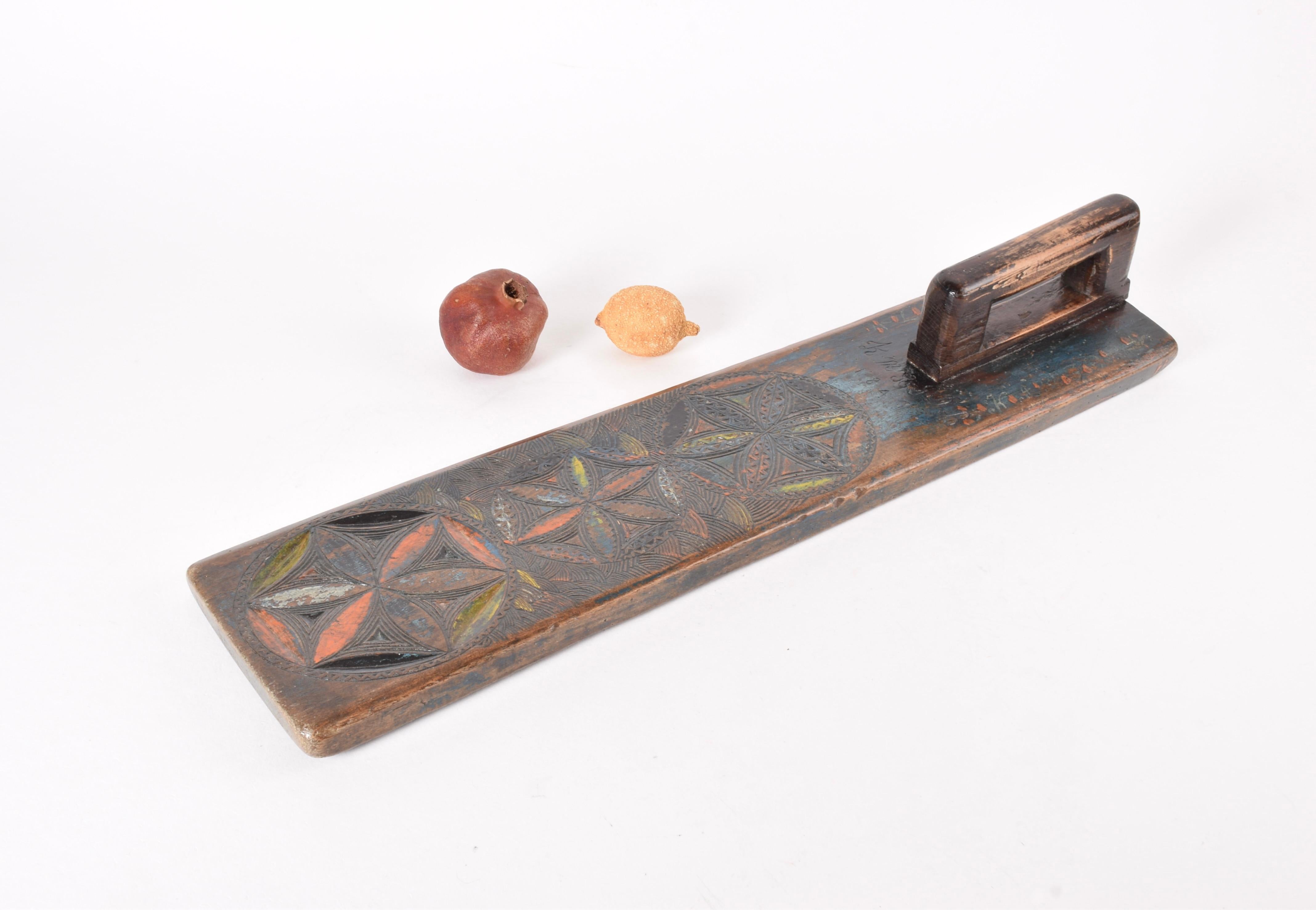 Antique Danish or Scandinavian mangle board (clothing and bedding press) dated 1941. It has this text cut into it: KM JDR 1841 and a short text painted on both sides of the handle. If pieces could talk …

It is made from oak wood and richly
