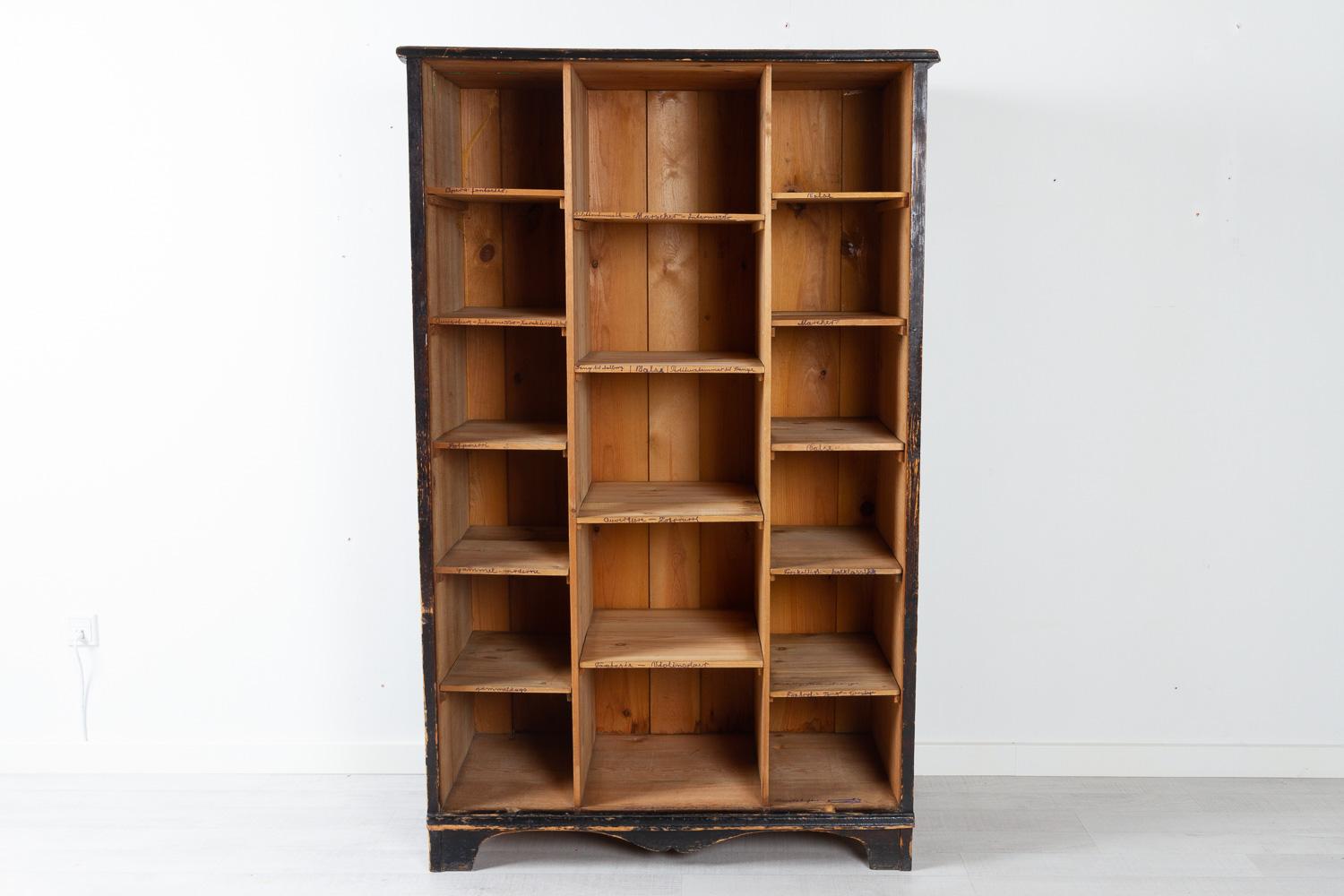 Antique Danish Black Closed Bookcase, ca. 1910.
Vintage ebonized bookcase or cupboard made in Denmark in the early 1900s. Rustic and charming cabinet with front that easily lifts off. Front has a lock and key. The inside is divided in many shelves