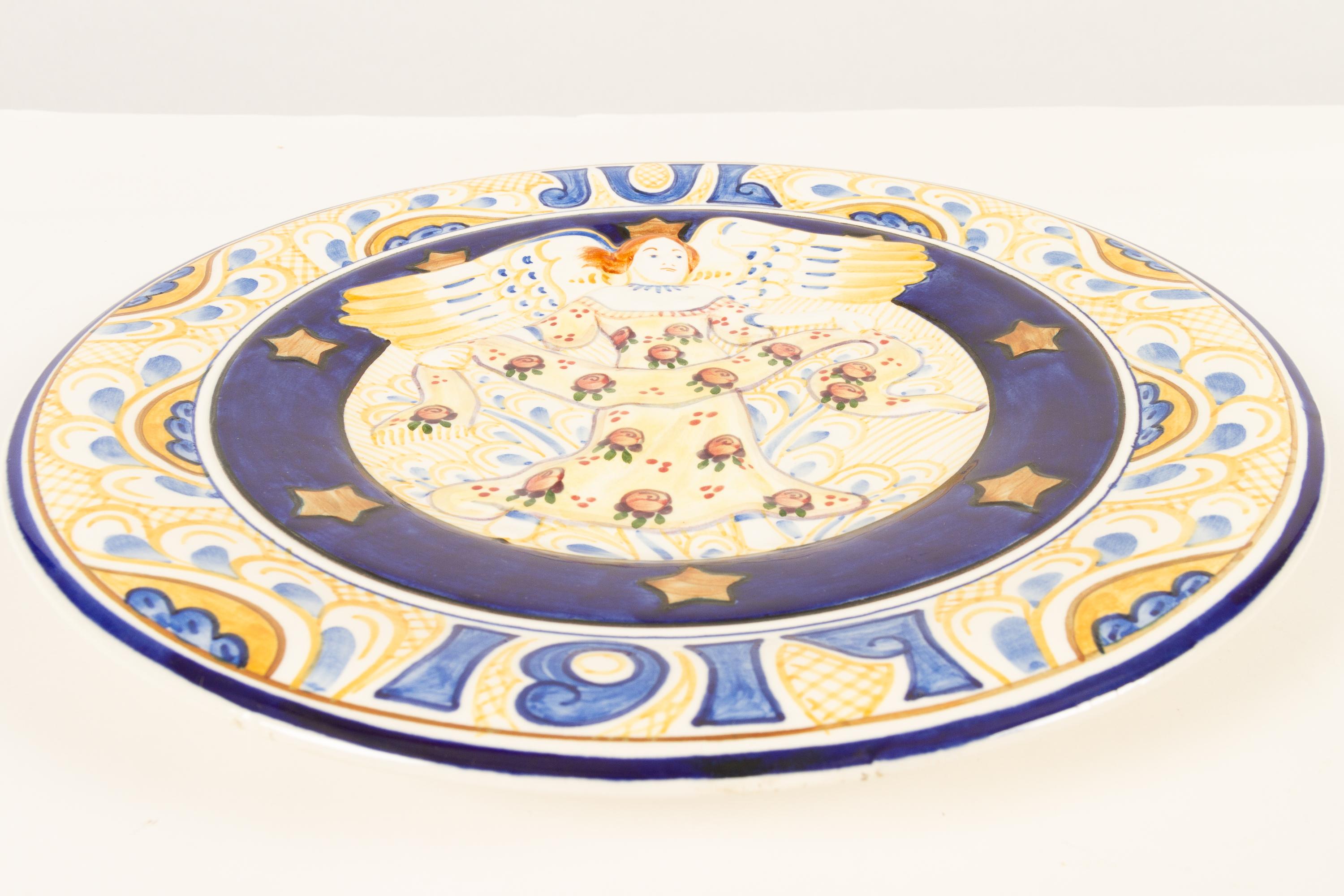 Antique Danish Christmas porcelain decorative plate by Aluminia, 1917.
Large Christmas plate by Aluminia (later Royal Copenhagen) in hand painted faience. The word 