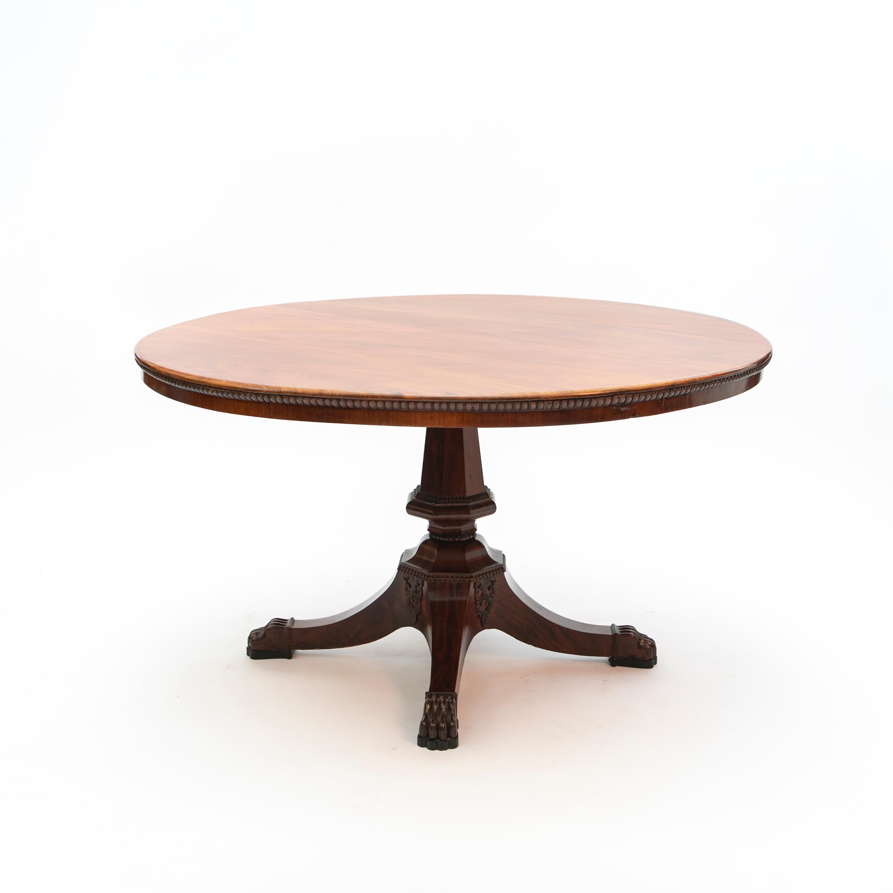 Early 19th century Danish empire / biedemeier mahogany center table.
Large circular top with beaded table apron and a hexagonal shaped column support ending on carved lion’s paw feet.

Copenhagen, Denmark 1820-1830

(Table can be disassembled
