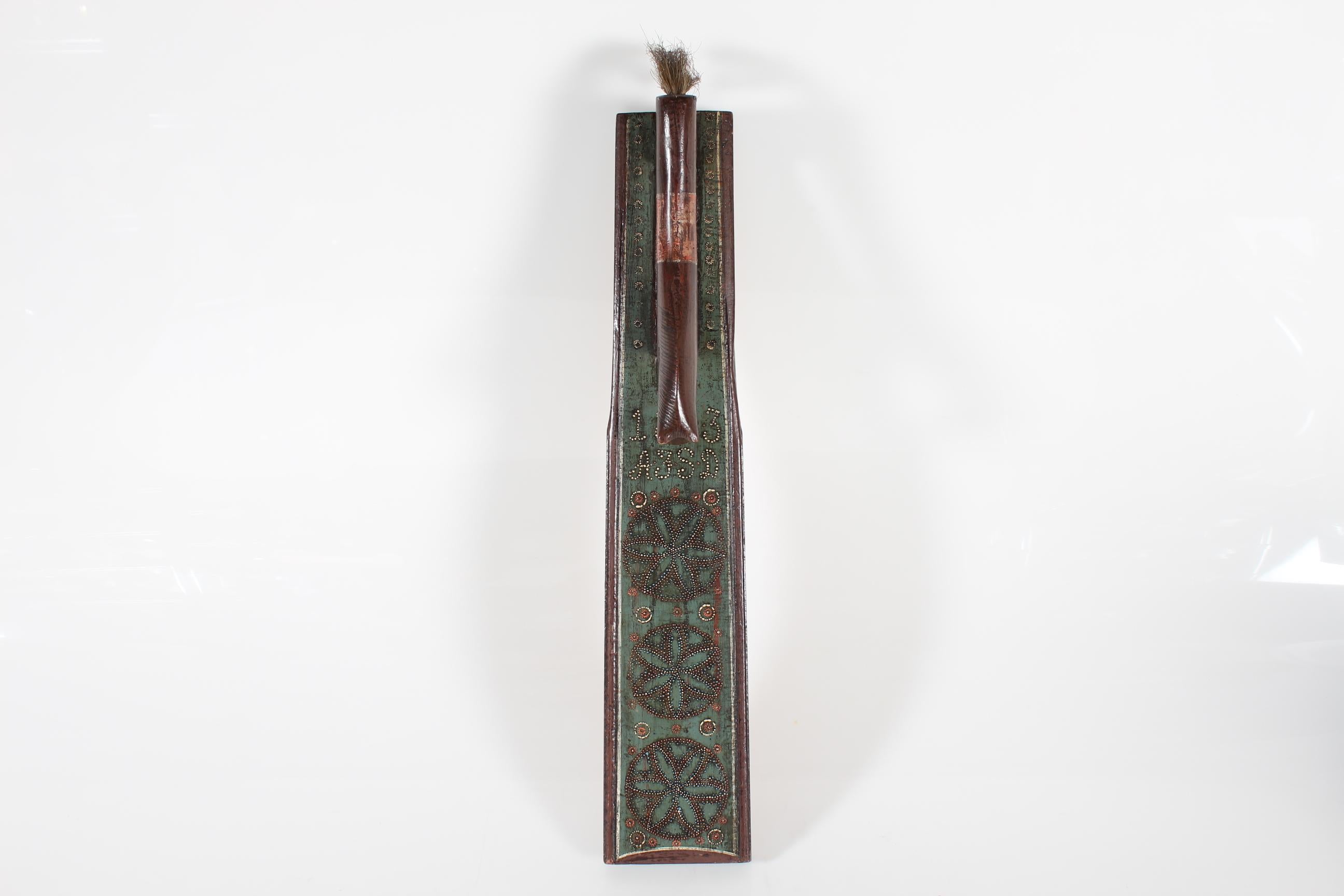Antique Danish mangle board (clothing and bedding press) dated 1803.

It is made from oak wood which is hand carved with a rich decoration of geometric blossoms. Painted in the colours green, white, brown and reddish brown. The handle is a carved
