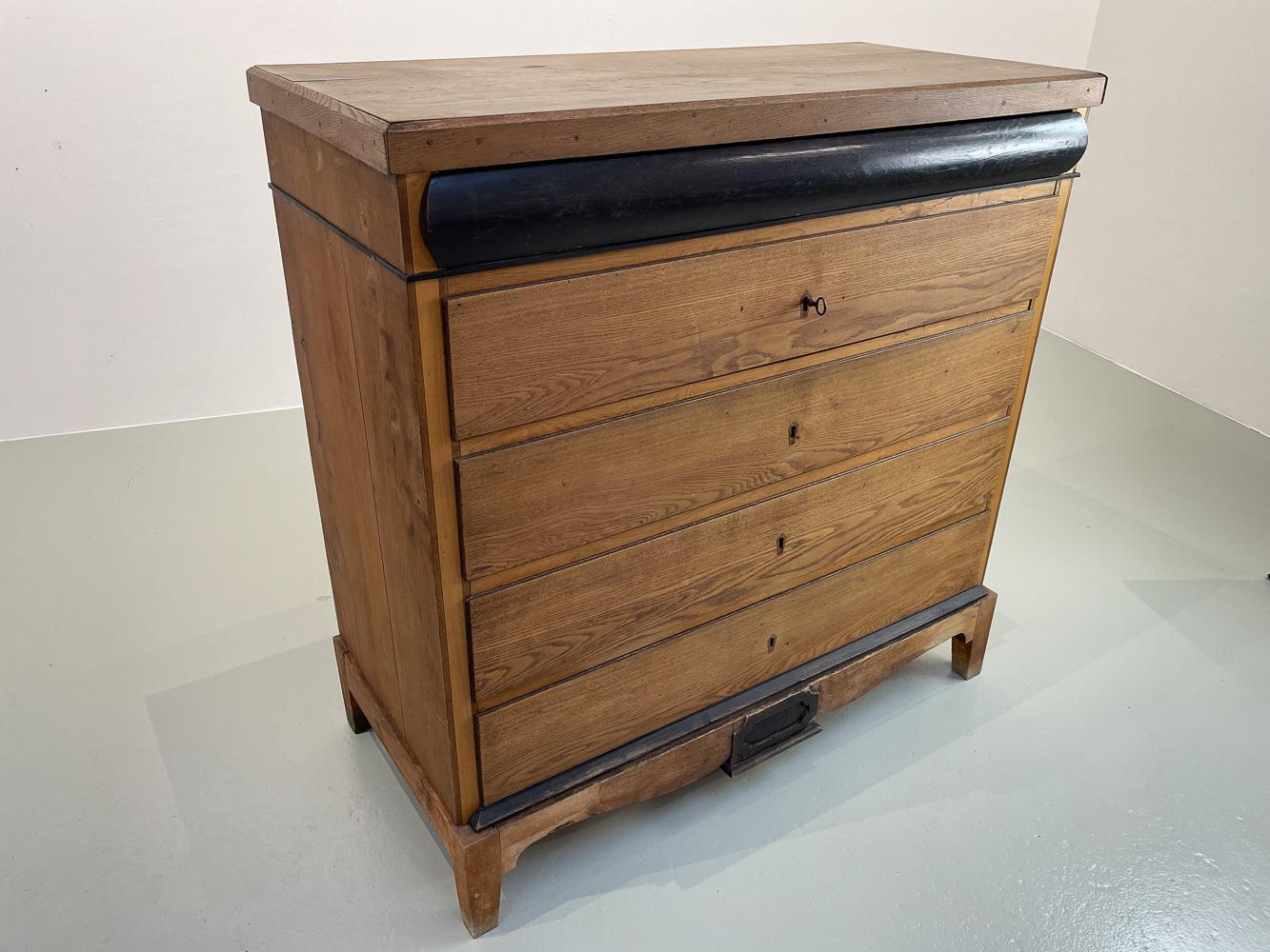 Antique Danish Oak Chest of Drawers, ca. 1800.
Amazing Empire oak dresser made by Danish master carpenter 1790-1810. Solid oak body and drawer fronts. Ebonized trim and concealed top drawer. Four drawers with original locks and key. Top drawer has a