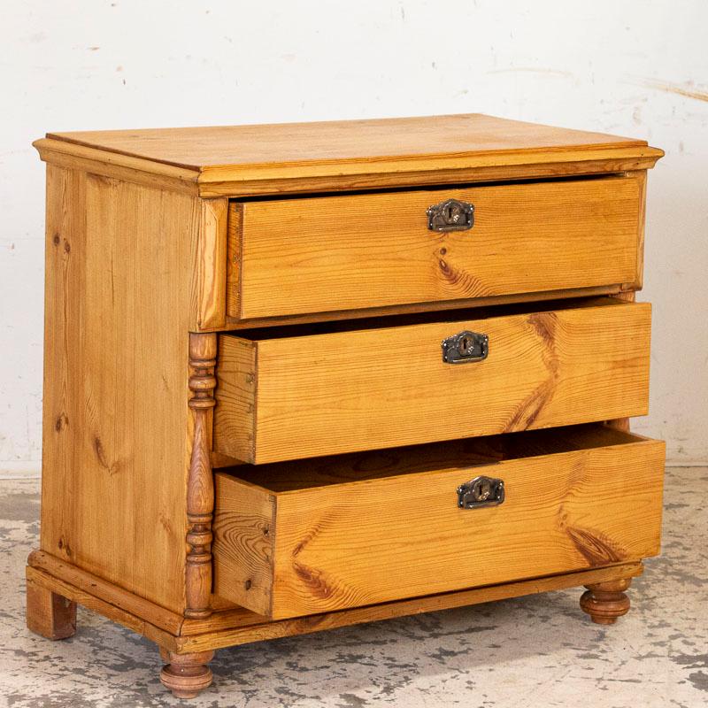 This lovely pine chest of drawers was a traditional element in Danish country homes throughout the 1800s. Notice the top drawer extends slightly outward over the lower two drawers, and all are accented by decorative half columns along the sides.