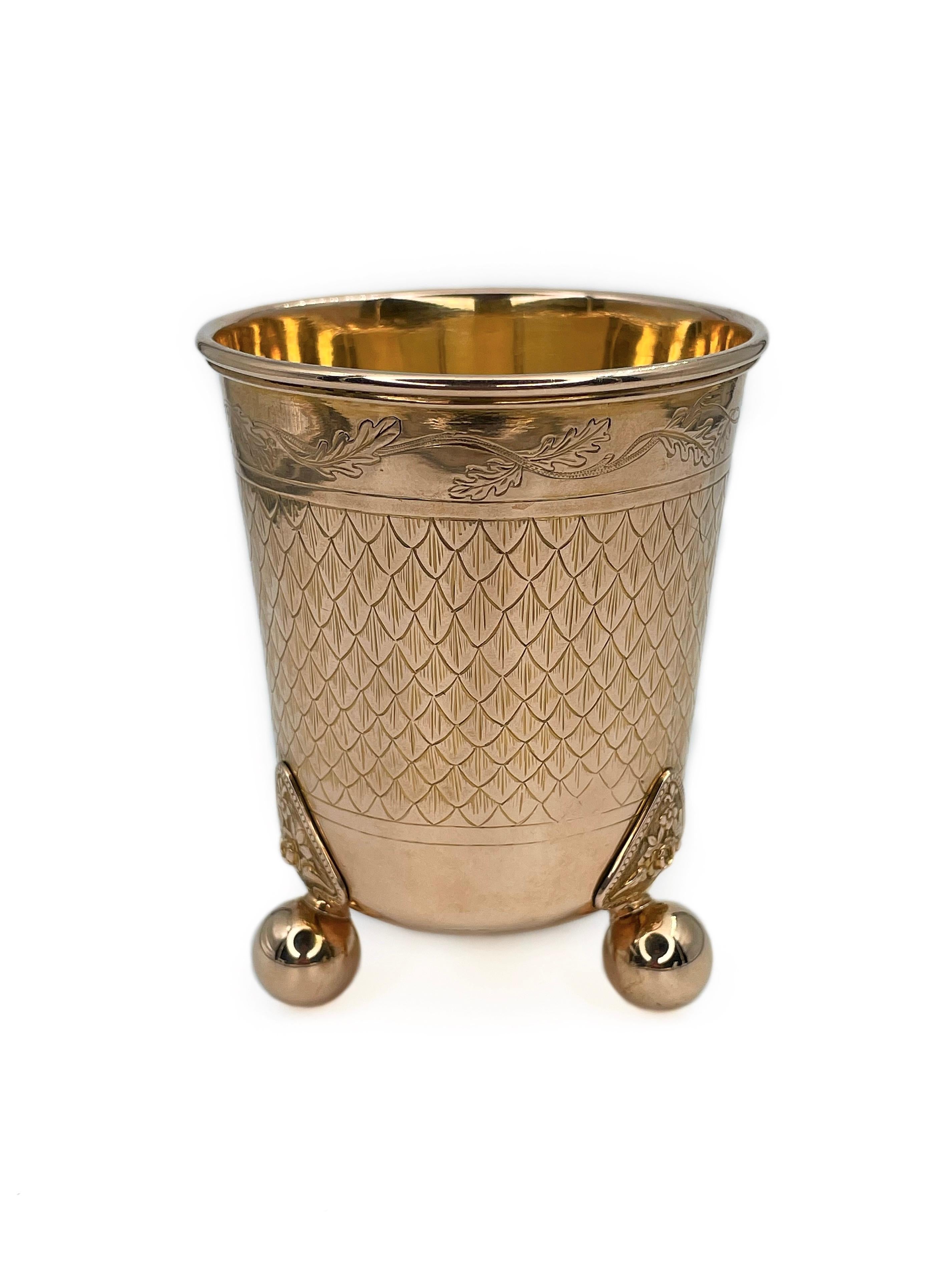 This is an antique 19th century beaker on ball feet made by Danish goldsmith Rasmus Jensen. The piece is crafted in 14K gold and is adorned with subtle floral ornamentations. 

There are numbers engraved inside: 1870 (shown in photo). 

Signed on