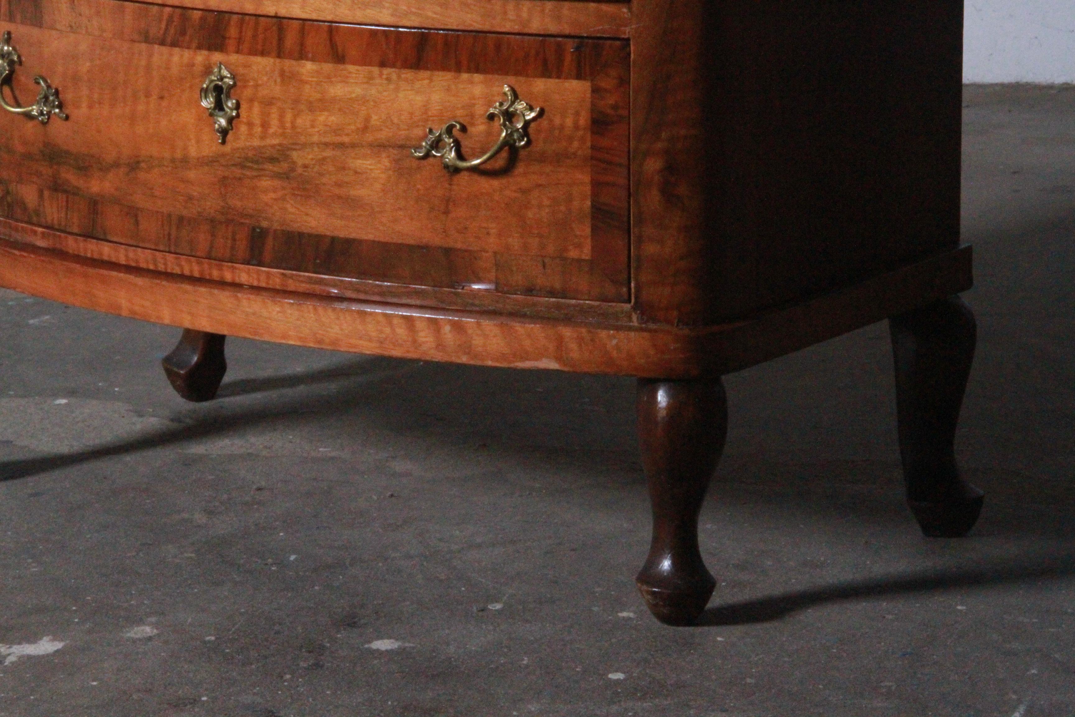 Beautiful antique chest of drawers from the 19th century, known for its exceptional weight due to the thick wood used, which gives it a very strong and powerful appearance. This Baroque-style piece fits well in modern homes seeking high-quality