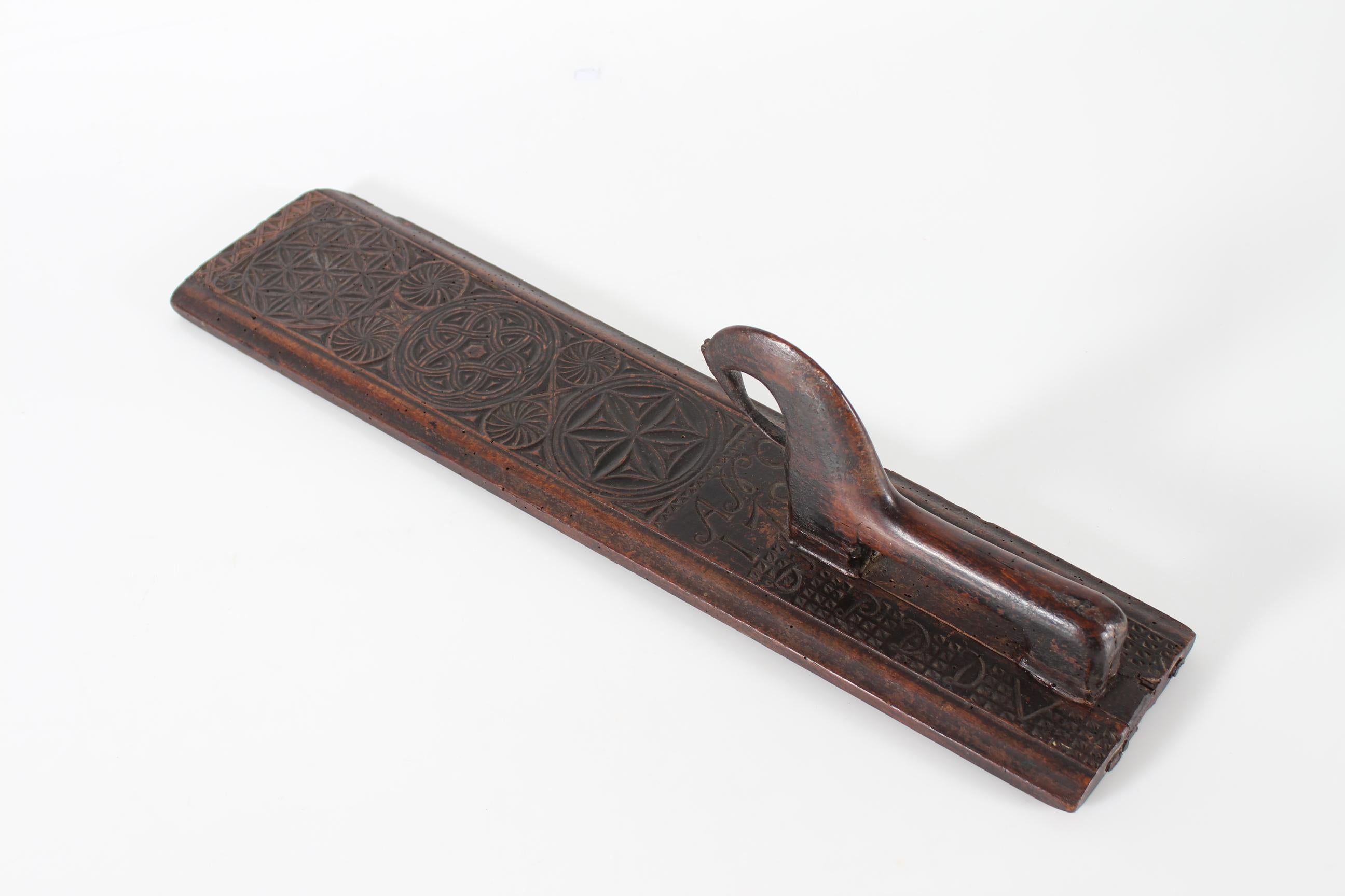 Danish mangle board (clothing and bedding press) dated 1784.

Made of wood richly decorated with hand-carved geometric patterns and an extraordinary horse as handle.
The decoration also shows initials and the year 1784.

…………………
The wooden mangle