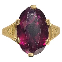 Anello antico con ametista scura e pietra naturale