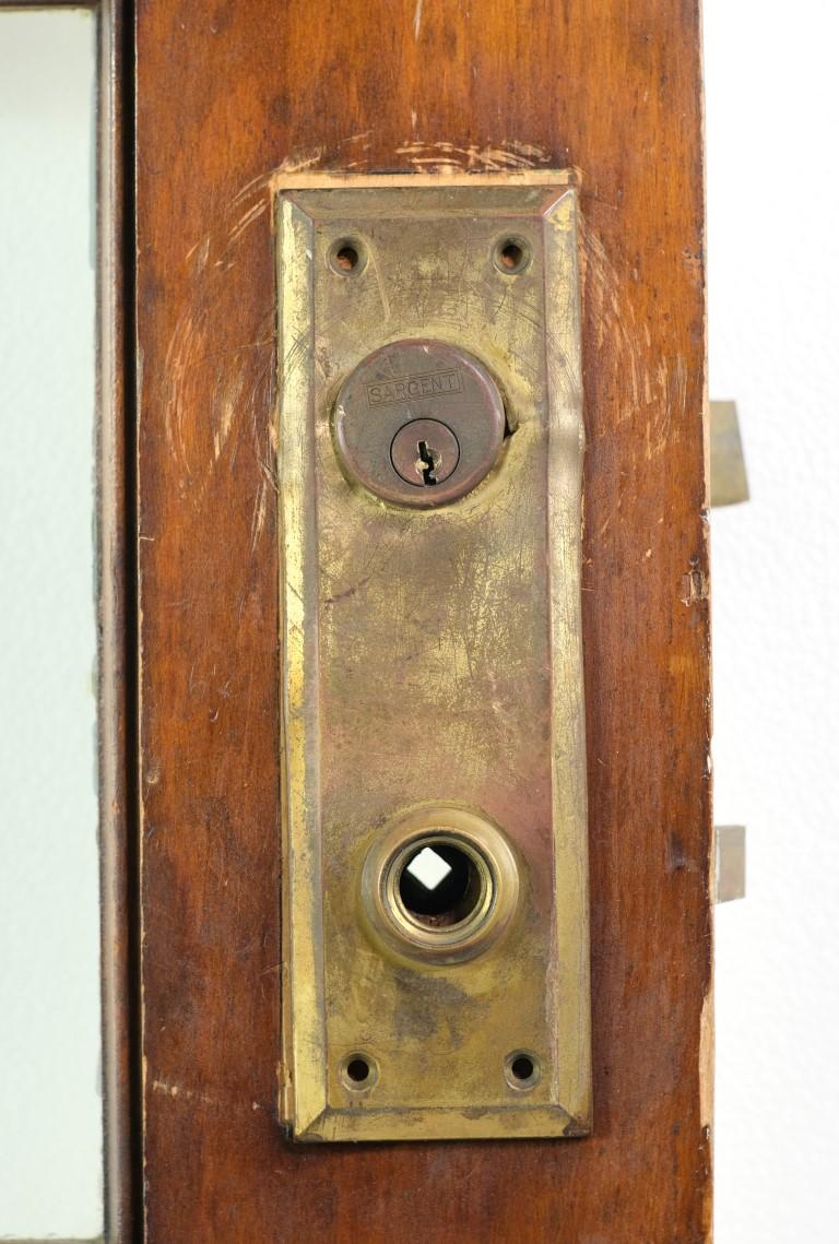 Single antique 15-Lite French door made of solid birch wood. It has a dark tone wood on one side and the other side is painted white. There are 15 vertical glass panes in good condition. Measures: 83.25