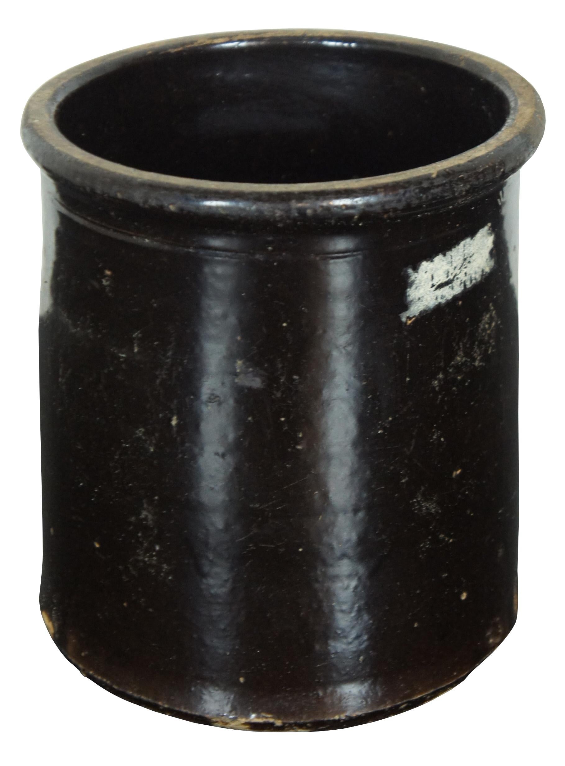 Antique dark brown glazed stoneware crock with straight sides. Size: 8