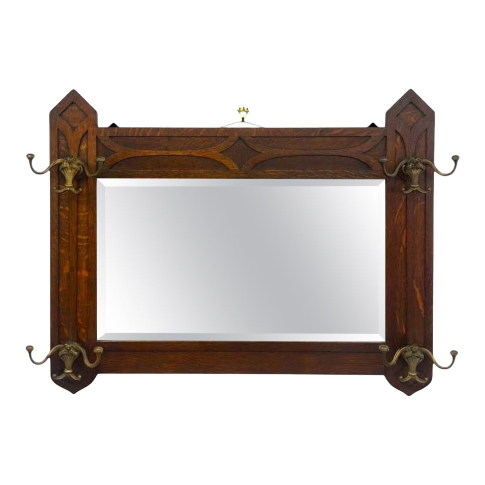 Antique Dark Oak Gothic Revival Hall Mirror with Brass Hooks. For Sale
