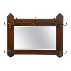 Antique Dark Oak Gothic Revival Hall Mirror with Brass Hooks.