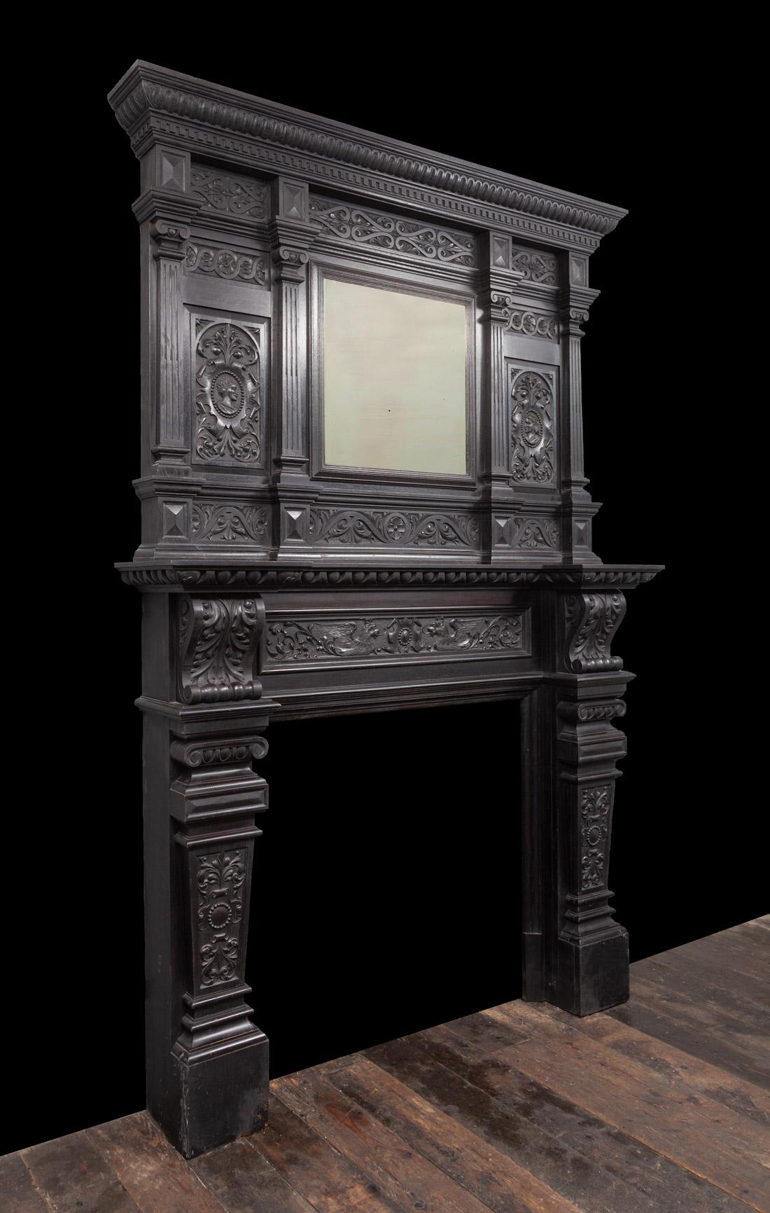 Carved Antique Dark Oak Jacobean Mantlepiece with Over-mantle Mirror For Sale