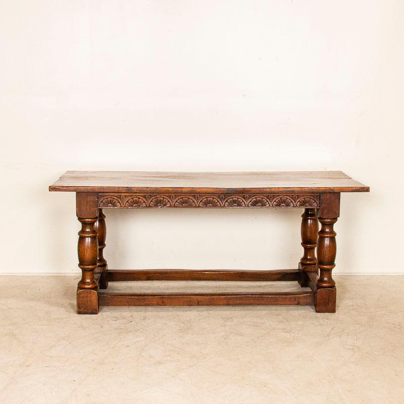 French Antique Dark Oak Refectory Library Table with Decoratively Carved Skirt from Fra