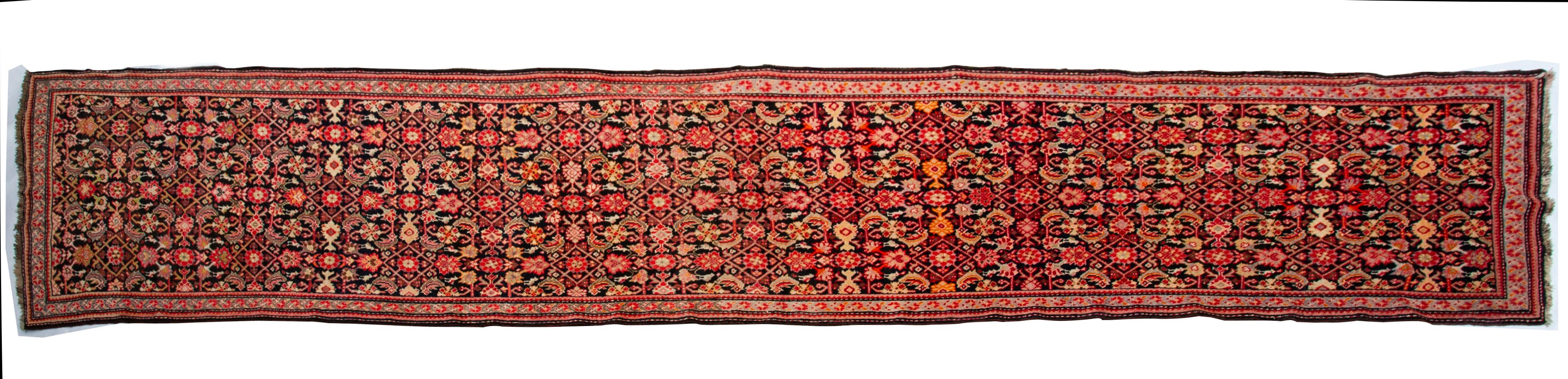 Nr. 1068 -  Beige and red minute design on a black background for this elegant Caucasian Karebagh (or Garebagh) Shusha runner : dated 1318 and signed .  With a  thick red and  an ivory 