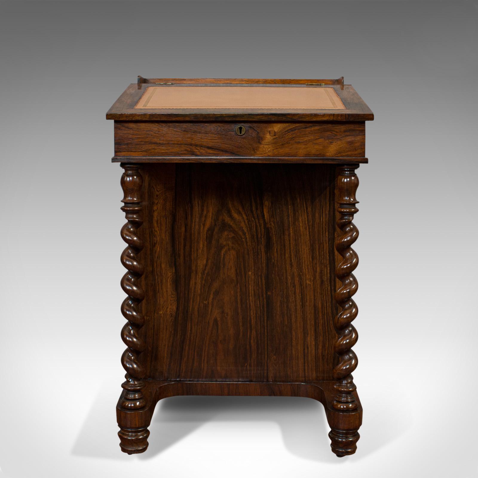 This is an antique Davenport. An English, rosewood and satinwood writing desk, dating to the Victorian period, circa 1880.

Dashing Victorian Davenport
Displays a desirable aged patina
Splendid rosewood offers fine grain interest and rich russet