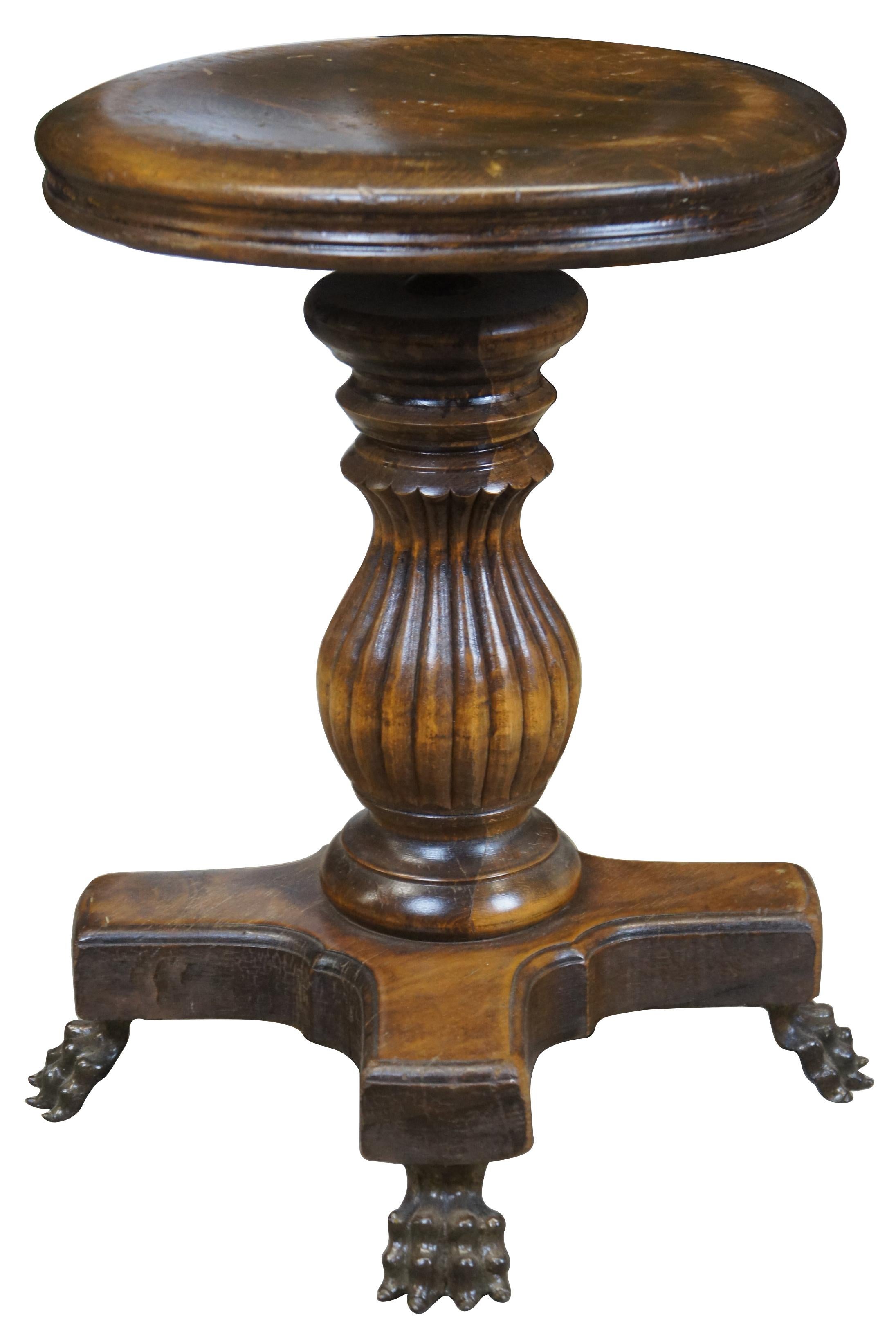 American walnut antique piano stool by Davis Chair Company of Marysville Ohio.
 