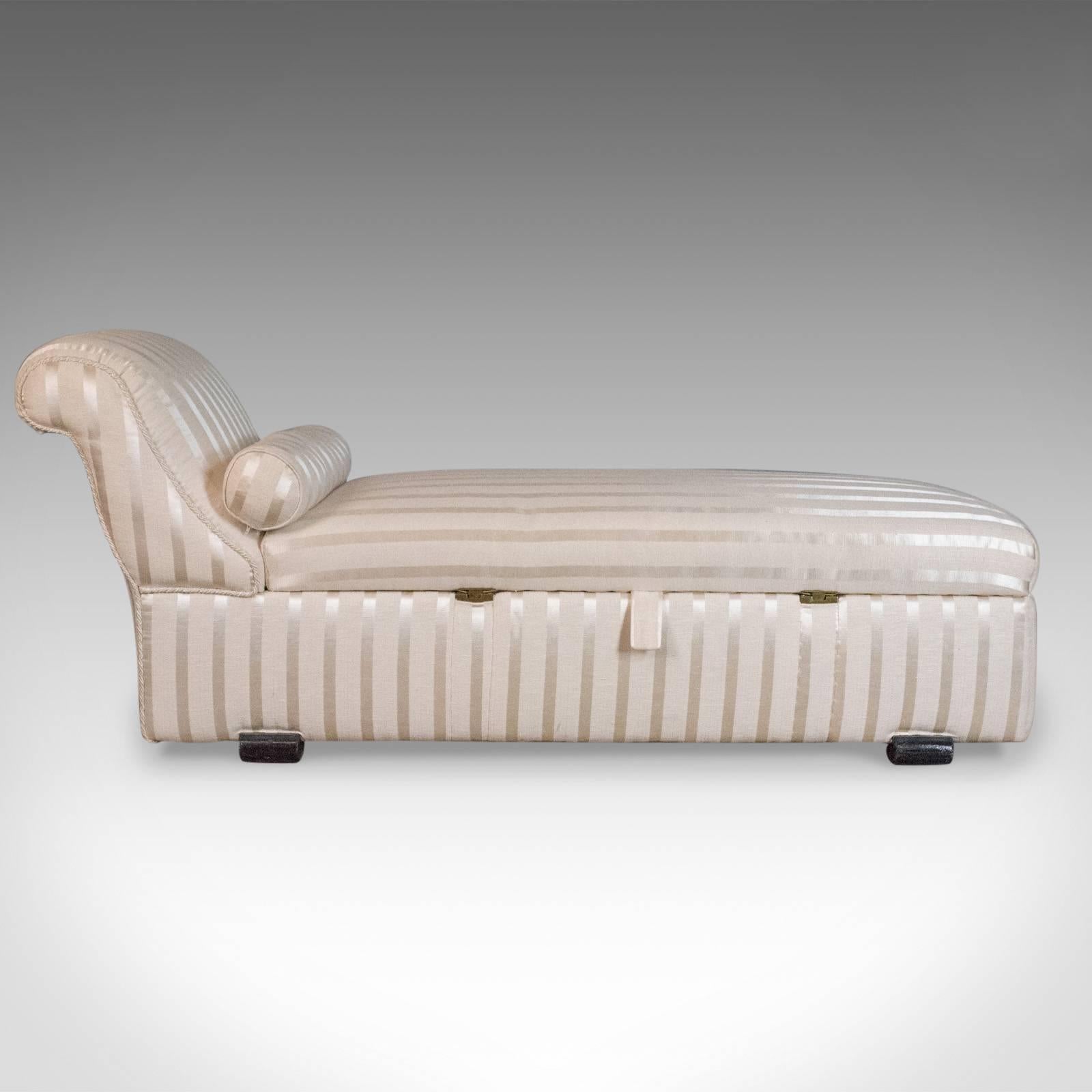 This is an antique daybed, an English, Victorian recliner, chaise longue dating to circa 1900.

Of quality craftsmanship, comfortable and supportive
Offering useful, voluminous storage beneath
Accessed from either side with dual action