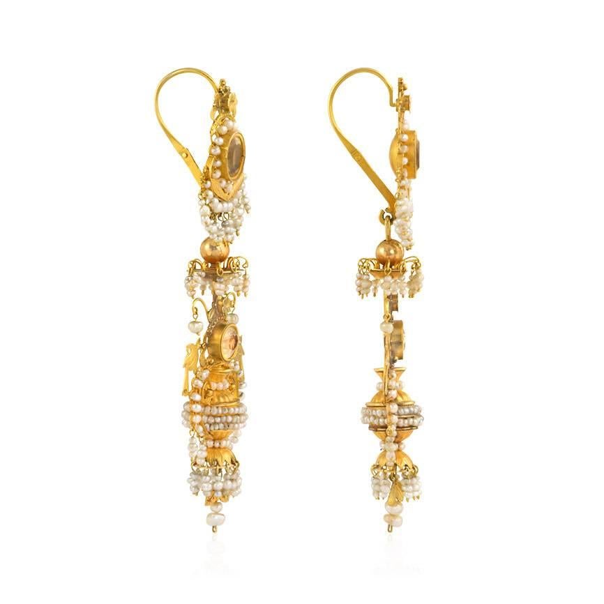 A pair of antique, early 19-century gold filigree, foiled citrine, and seed pearl earrings in the form of stylized urns with foliate and bird motifs, in 14k.  Probably Neopolitan.

These unique and glamorous chandelier earrings manage to be