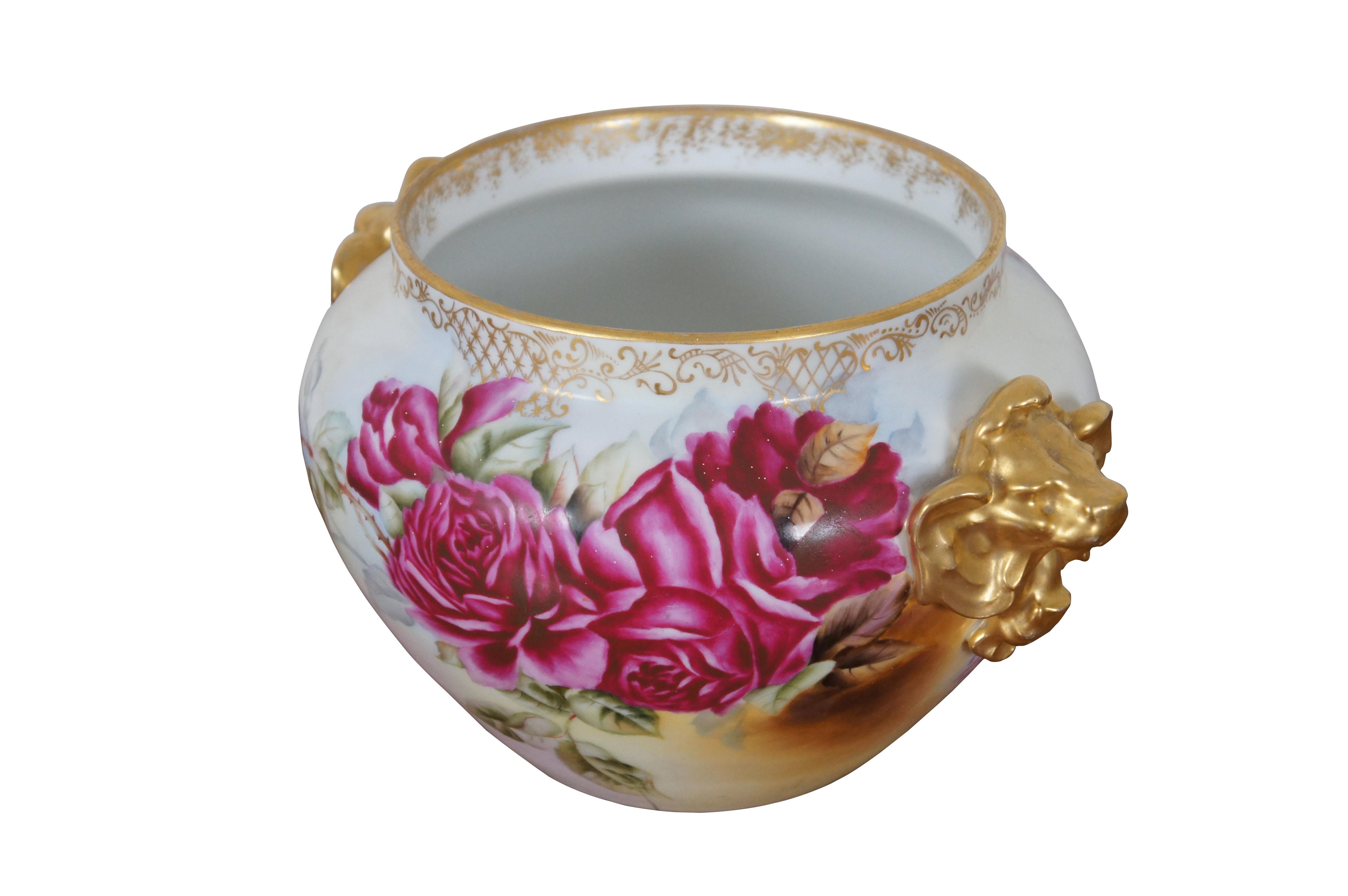 Antique French 1898 D&Co Limoges France cachepot / jar / planter featuring floral rose theme with gold gilded lion handles.  Marked A.H. Nov. 2 - 1898.  D&Co France R. Delinières Limoges 1894 - 1900 mark.

The factory was established in 1863 by Rémi
