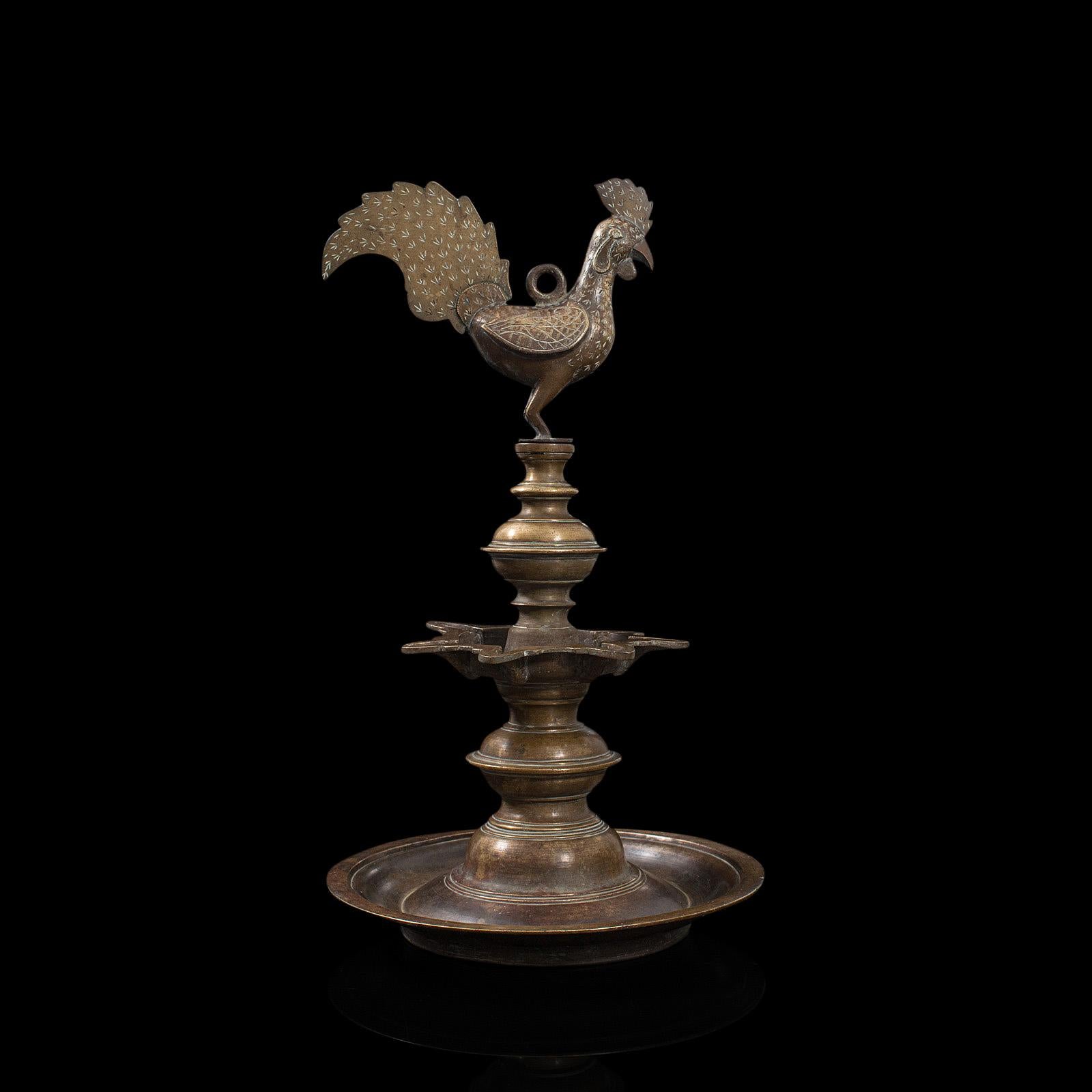 This is an antique Deccan oil lamp. An Indian, bronze hanging lamp with Hamsa bird finial, dating to the late 19th century, circa 1900.

Hanging lamps are commonly found in temple sanctuaries
Displaying a desirable aged patina and in good