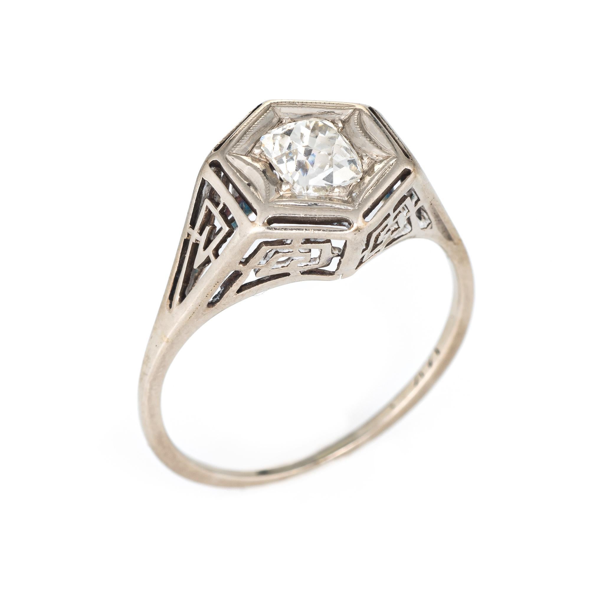Finely detailed vintage Art Deco era ring (circa 1920s to 1930s) crafted in 14 karat white gold. 

Centrally mounted estimated 1.35 carat old cushion cut diamond (estimated at J-K color and SI2 clarity).  

The ring features a hexagonal mount that
