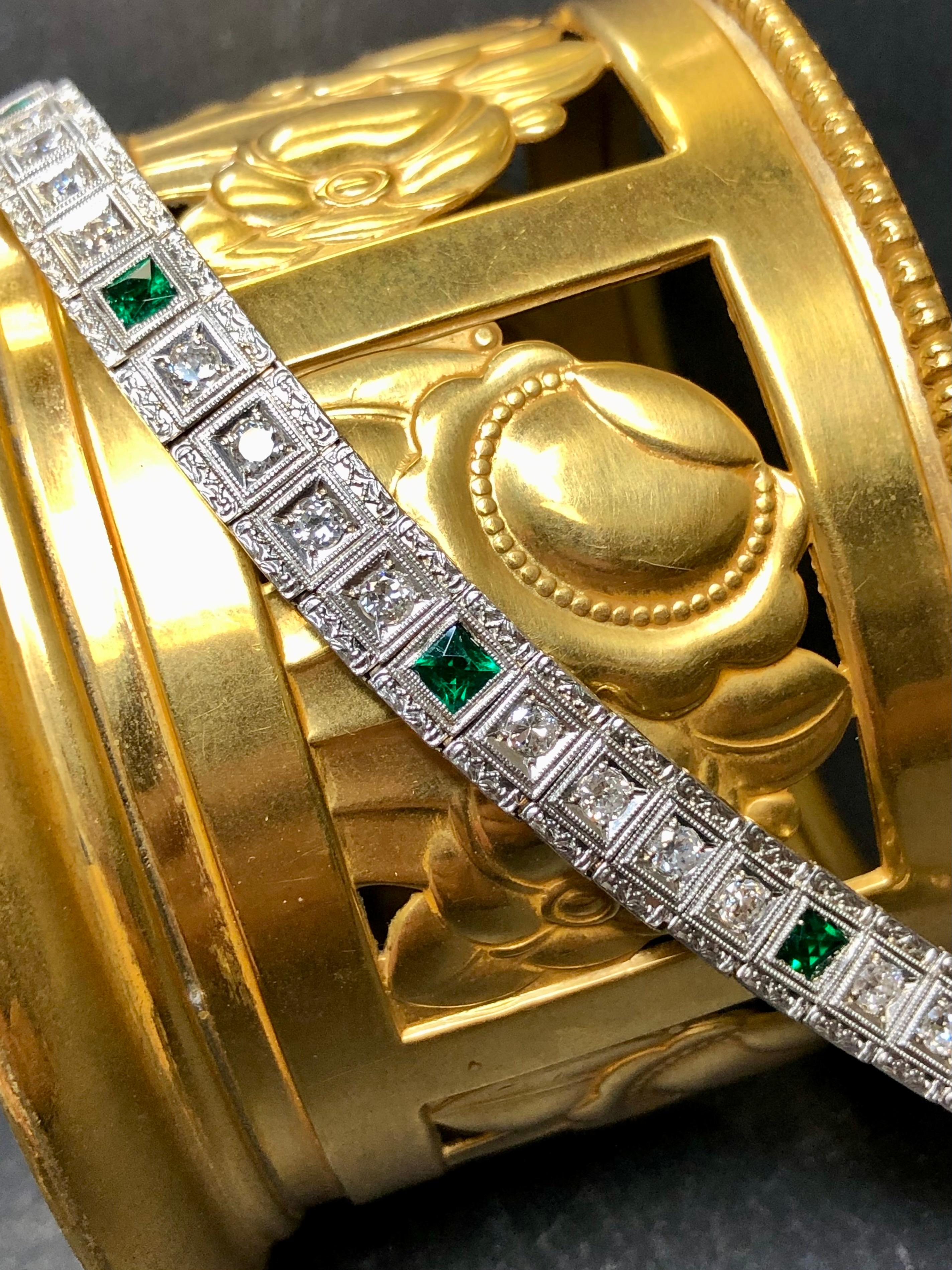 An original line bracelet from the Art Deco era done in 14K white gold and set with approximately 2.80cttw in all original old European cut diamonds averaging G-I in color and Vs1-2 in clarity. There are also 7 square cut synthetic emeralds bezel