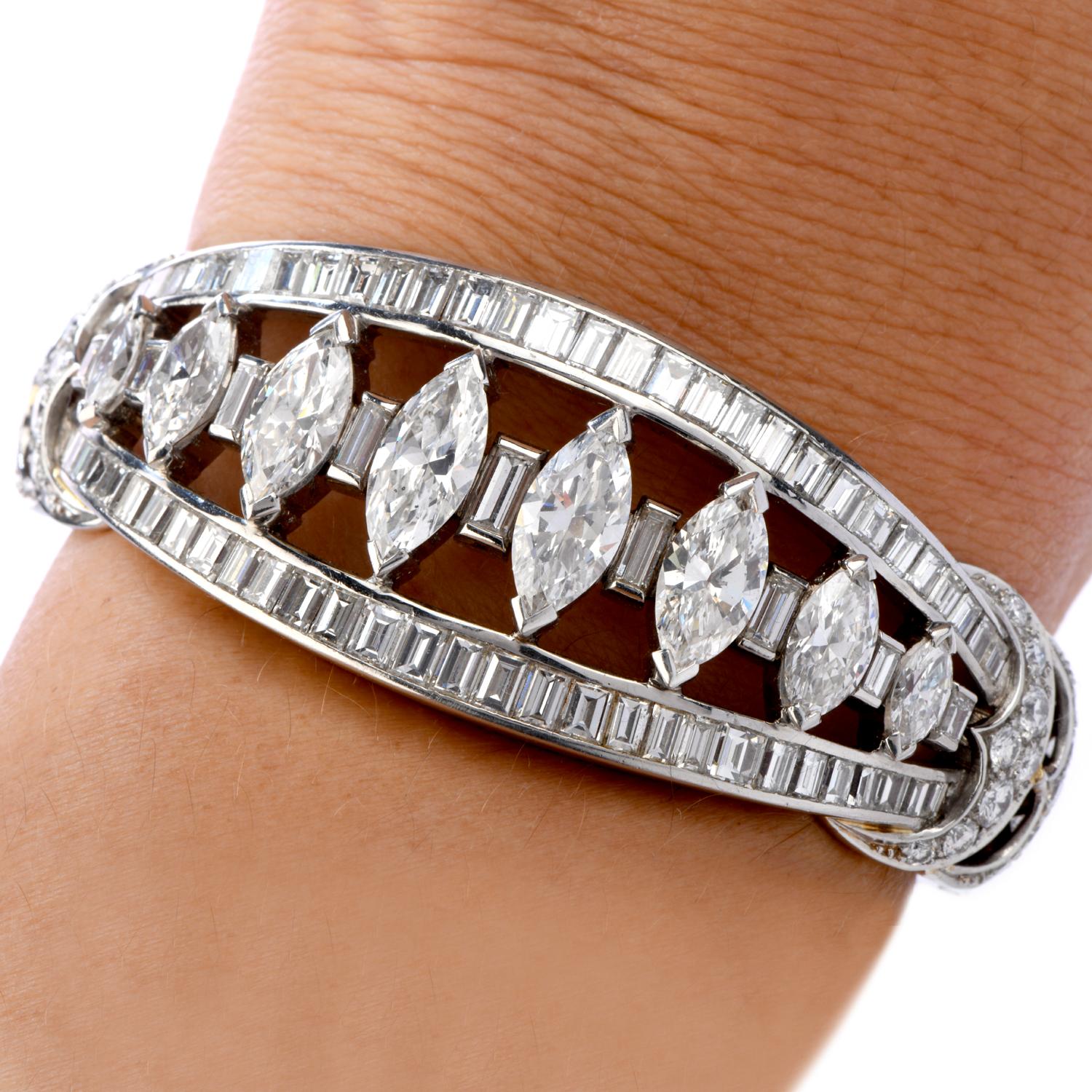 Adorn your wrist with this exquisite Vintage platinum, and 18k Gold cuff Diamond bangle bracelet set with marquise, baguette, and round-cut diamonds. This Antique Deco bracelet has double-hinged ends for ease of wear.

\Metal Type:  Platinum

Total