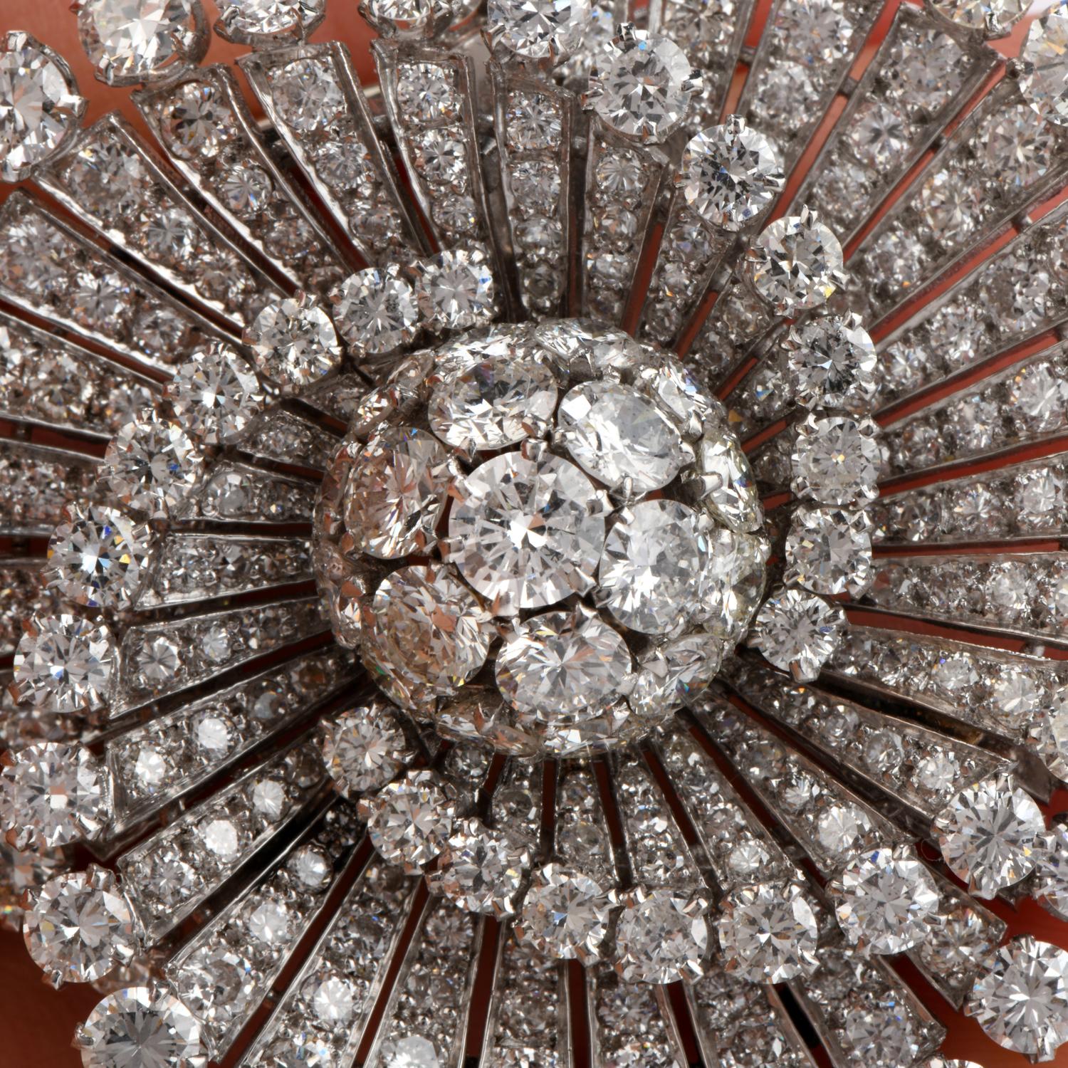 This Stunning Antique 1930's Solid Platinum brooch pin features a fan design motif centered with cluster of 19 genuine round diamonds. It is further adorned with approx. 230 genuine round brilliant cut Diamonds.

Total diamonds are approx. 20.98