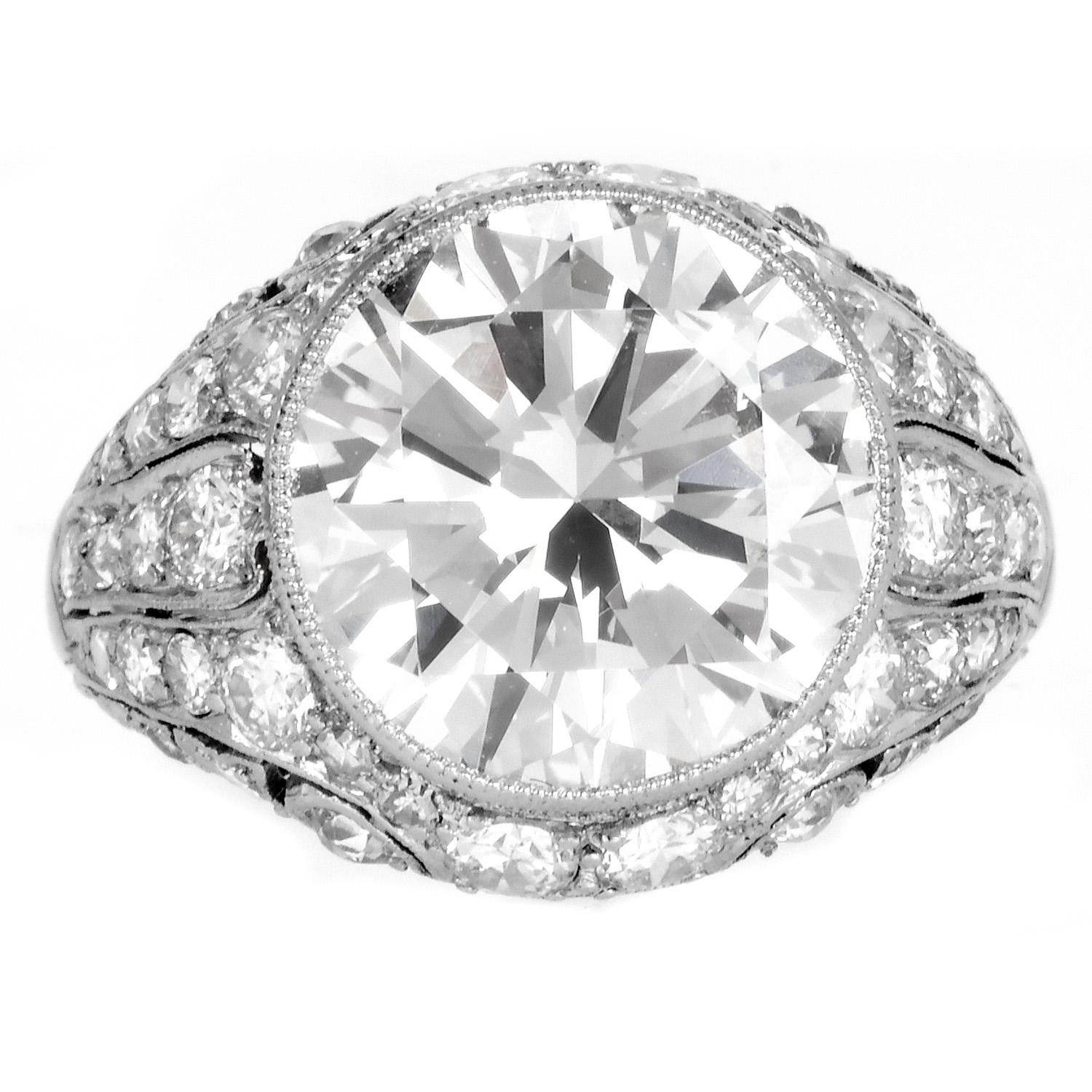 Alluring Vintage Deco Platinum Ring, this exquisite piece features a stunning weighing approx. 6.14 carat round diamond, boasting approx K-L color and VS clarity. Each facet of the diamond reflects light magnificently, secured within a
