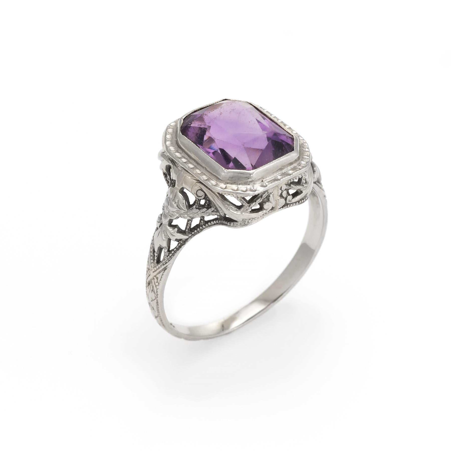 Finely detailed vintage Art Deco era cocktail ring (circa 1920s to 1930s), crafted in 14 karat white gold. 

Centrally mounted amethyst measures 9mm x 7mm (estimated at 2 carats). The amethyst is in excellent condition and free of cracks or chips.  
