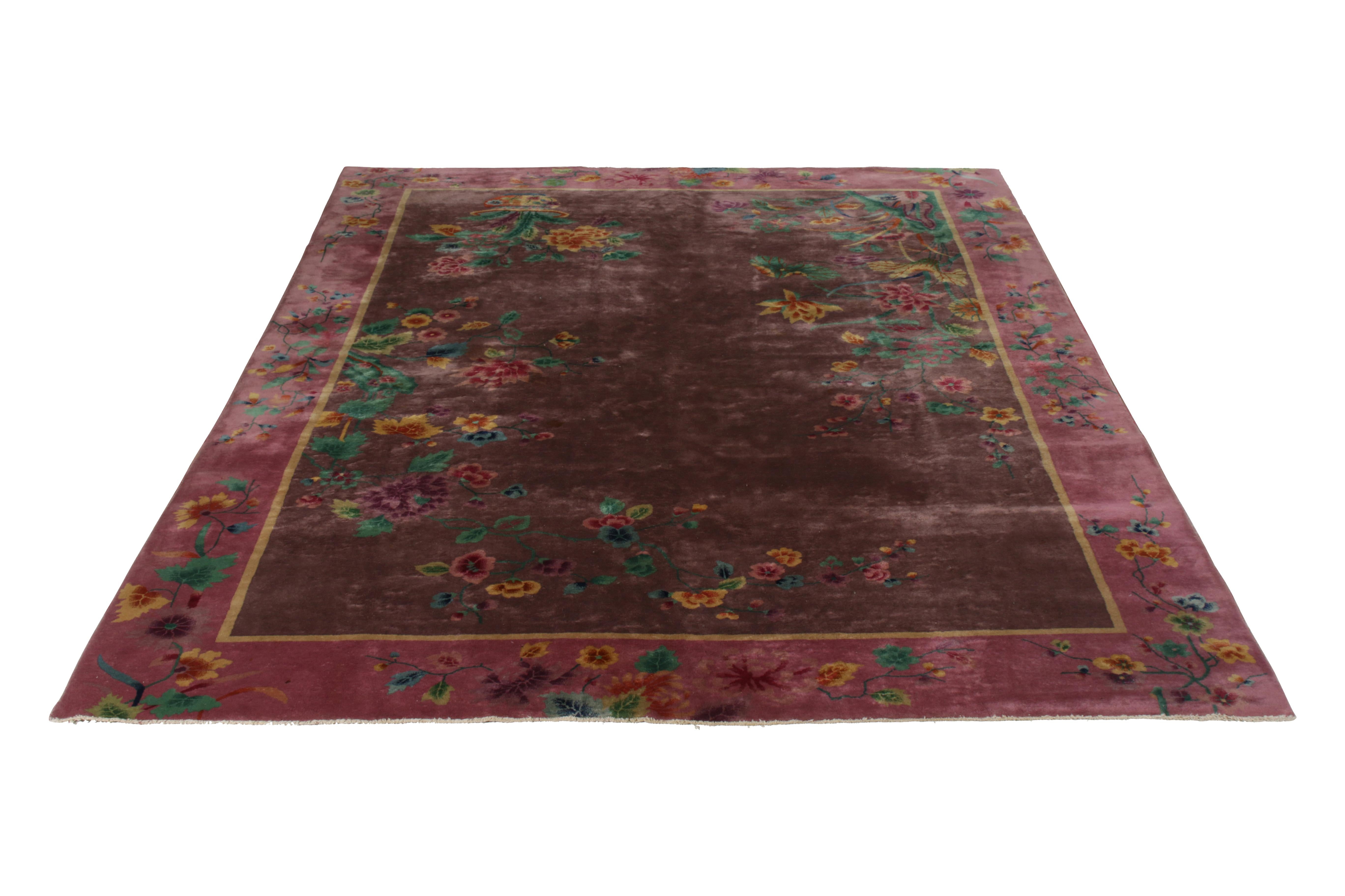 This antique purple wool and silk rug has a deco style from China, made apparent in its imagery. From 1920, the all-over field design is accented by highly stylized vases with flowers, where the bulk of the silk was woven to draw the eye to their