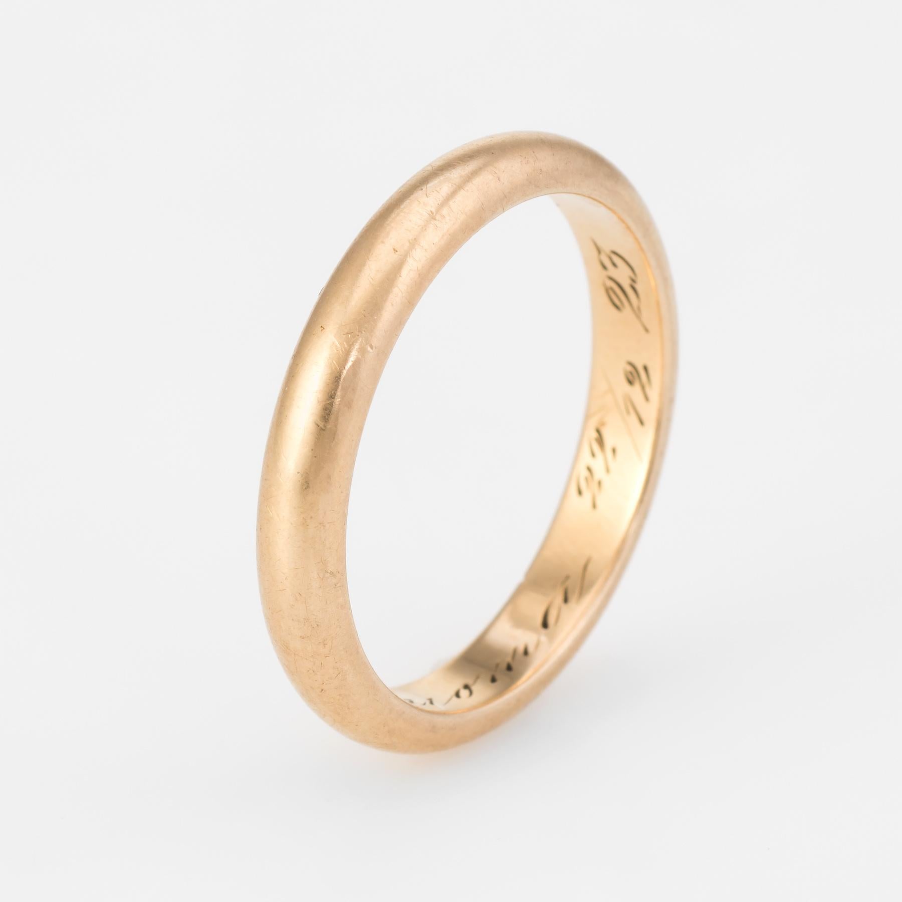 Art Deco era wedding band (circa 1923), crafted in 18 karat yellow gold.

The inner band is engraved and from what we can decipher it reads 