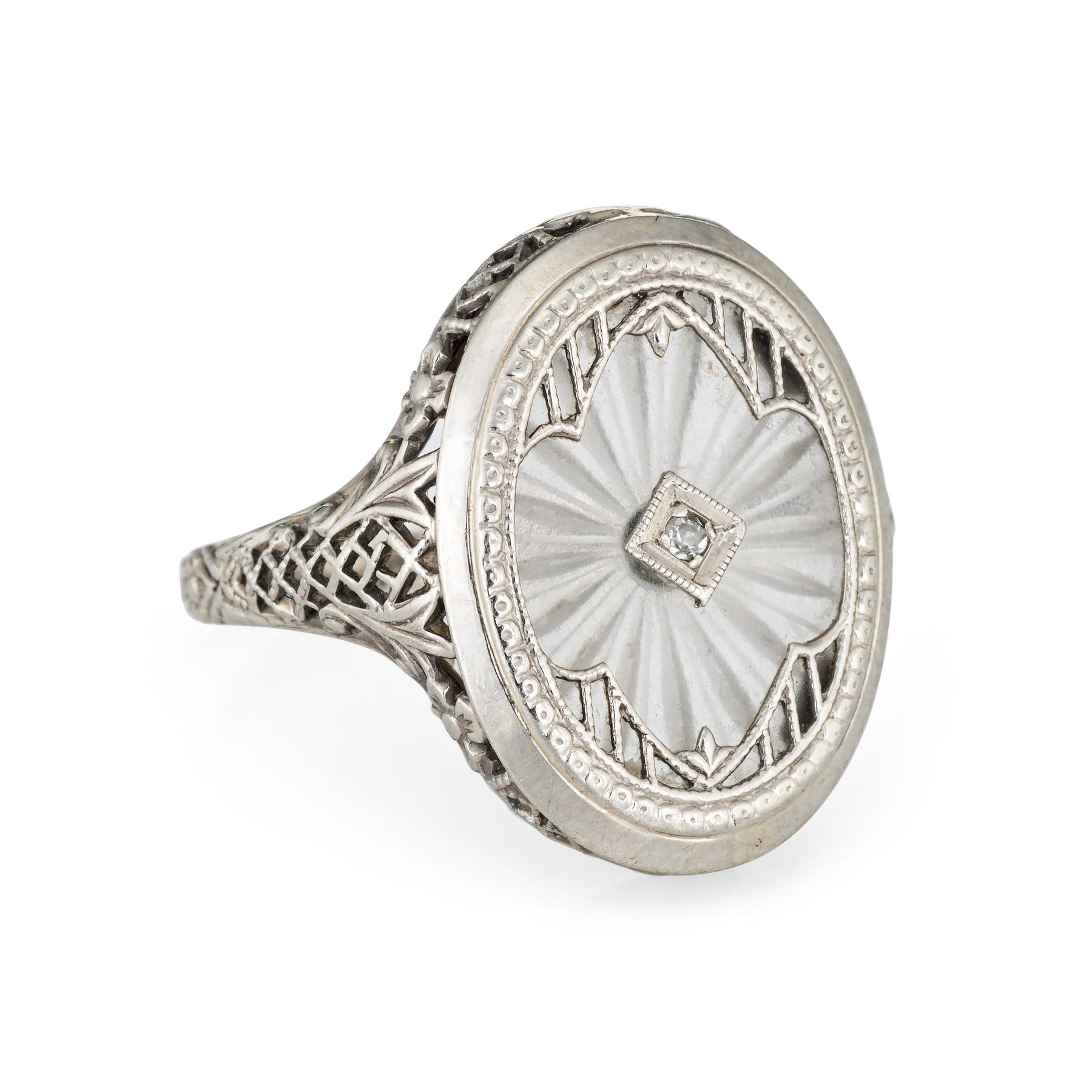 Elegant & finely detailed Art Deco era ring (circa 1920s to 1930s), crafted in 14 karat white gold. 

One estimated 0.01 carat single cut diamond is set into the mount (estimated at I-J color and I1 clarity). The camphor glass measures 15mm x