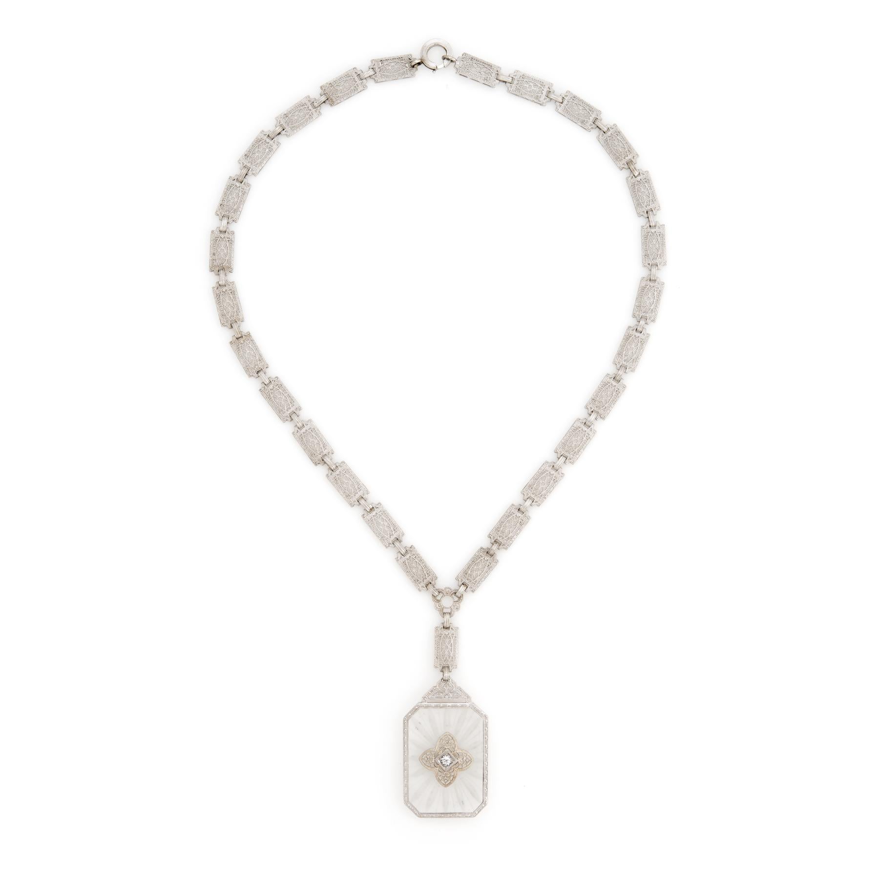 Finely detailed vintage Art Deco drop necklace (circa 1920s to 1930s), crafted in 14 karat white gold.  

The drop is set with an estimated 0.08 carat Old European cut diamond (estimated at H-I color and VS2 clarity). The camphor glass measures 28mm