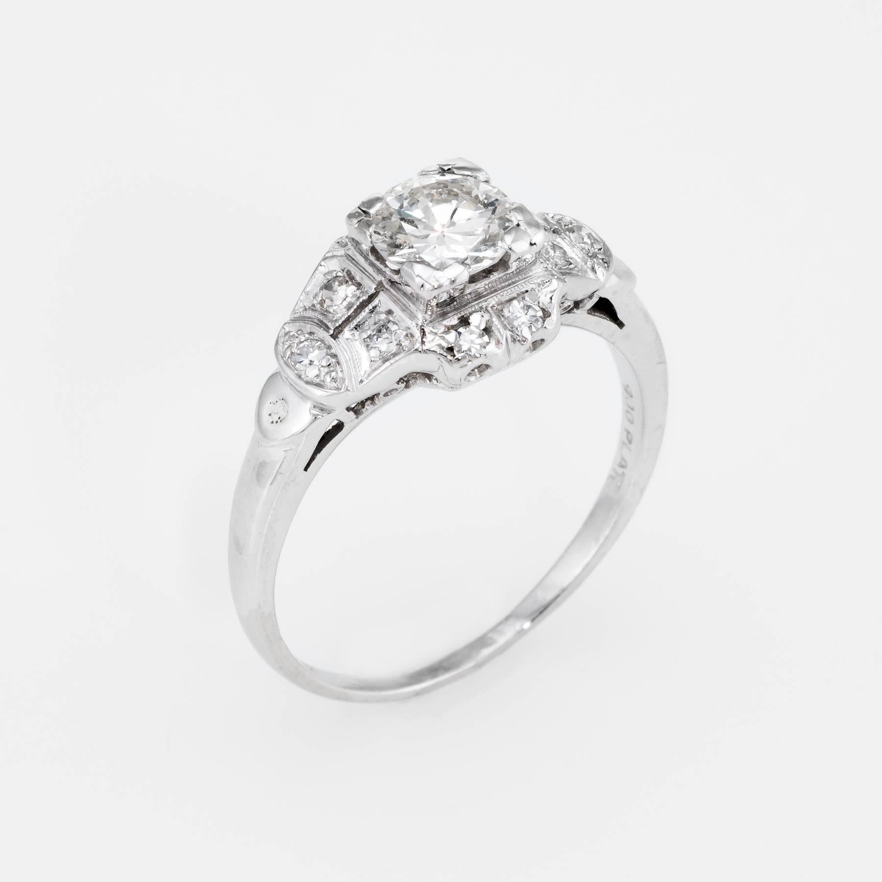 Finely detailed vintage Art Deco era ring (circa 1920s to 1930s), crafted in 900 platinum. 

Centrally mounted estimated 0.75 carat old European cut diamond is accented with 10 x 0.01 carat single cut diamonds. The total diamond weight is estimated