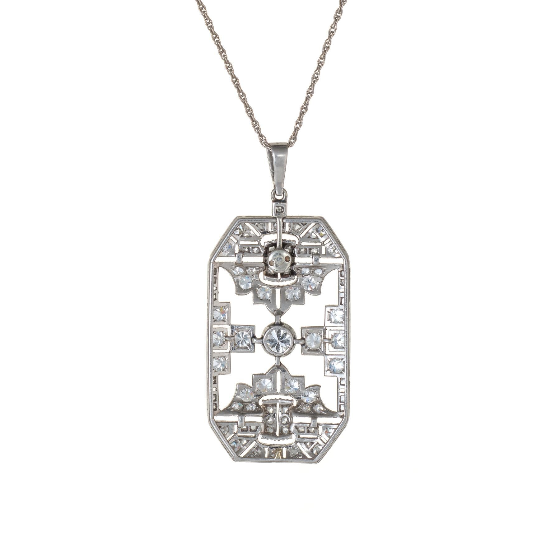 Finely detailed vintage Art Deco era pendant (circa 1920s to 1930s), crafted in 900 platinum.  
Old European, rose and single cut diamonds total an estimated 1 carat (estimated at I-J color and VS2-SI2 clarity).
Geometric detail overlaid with fine