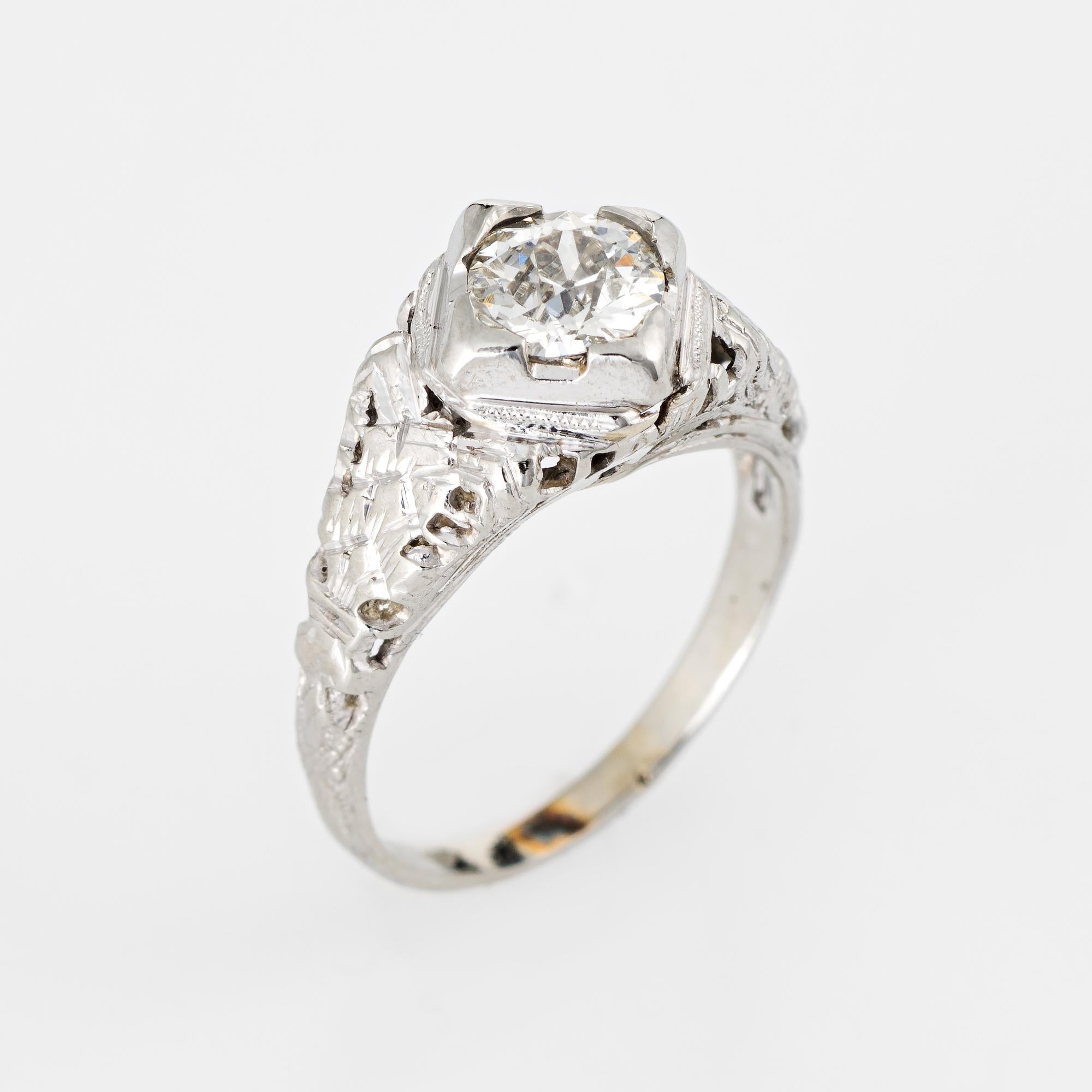 Elegant & finely detailed Art Deco era ring (circa 1920s to 1930s) crafted in 18k white gold. 

Centrally mounted estimated 0.52 carat old European cut diamond (estimated at H-I color and VS2 clarity).    

The ring epitomizes vintage charm and