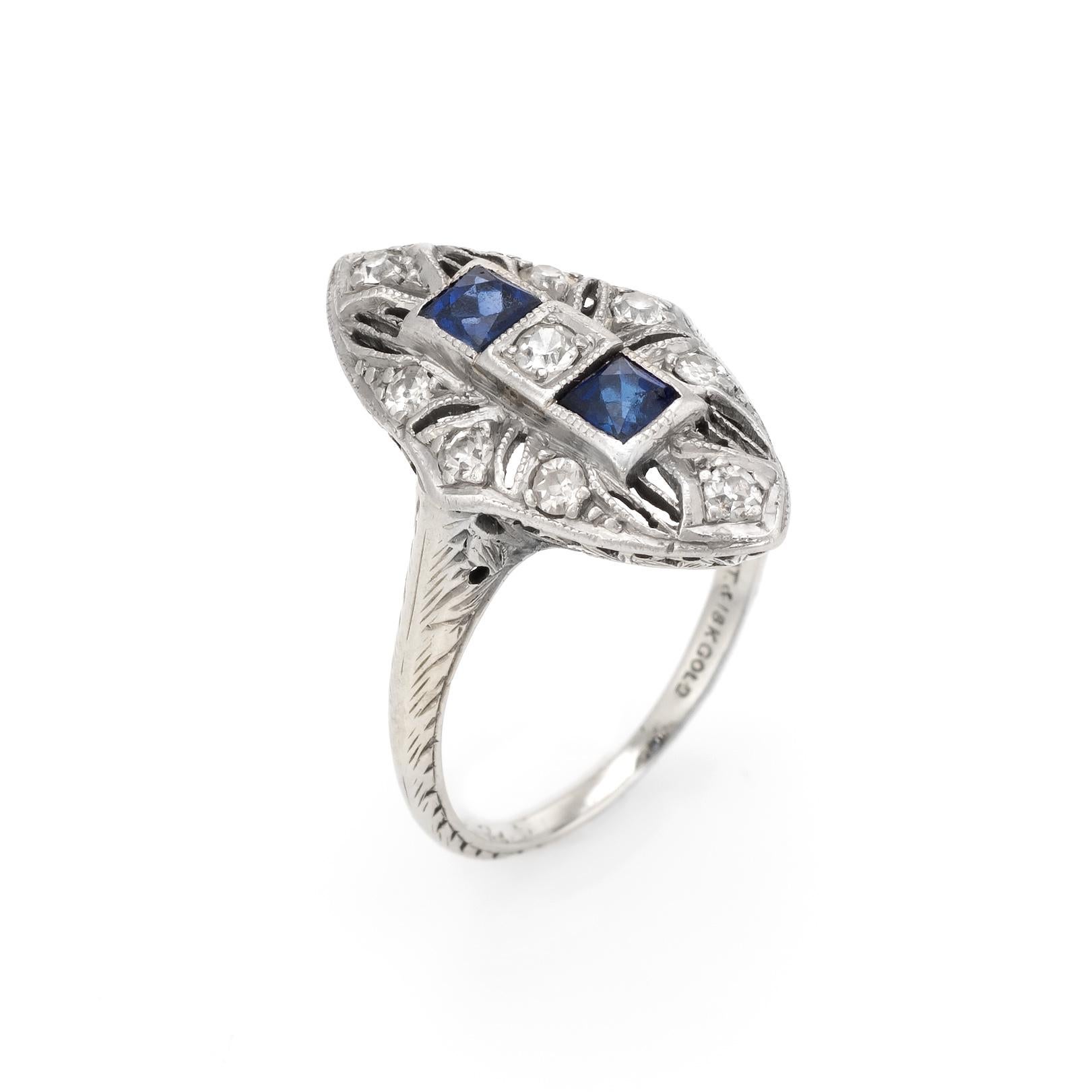 Finely detailed vintage Art Deco era cocktail ring (circa 1920s to 1930s), crafted in 900 platinum & 18 karat white gold. 

Centrally mounted estimated 0.04 carat old single cut diamonds is accented with a further 8 estimated 0.02 carat single cut
