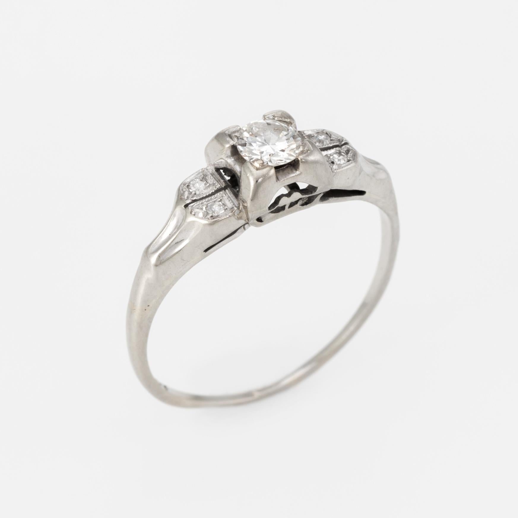 Elegant Art Deco era ring (circa 1920s to 1930s), crafted in 14 karat white gold. 

Centrally mounted Old European cut diamond is estimated at 0.22 carats, accented with four approx. 0.01 carat single cut diamonds. The total diamond weight is