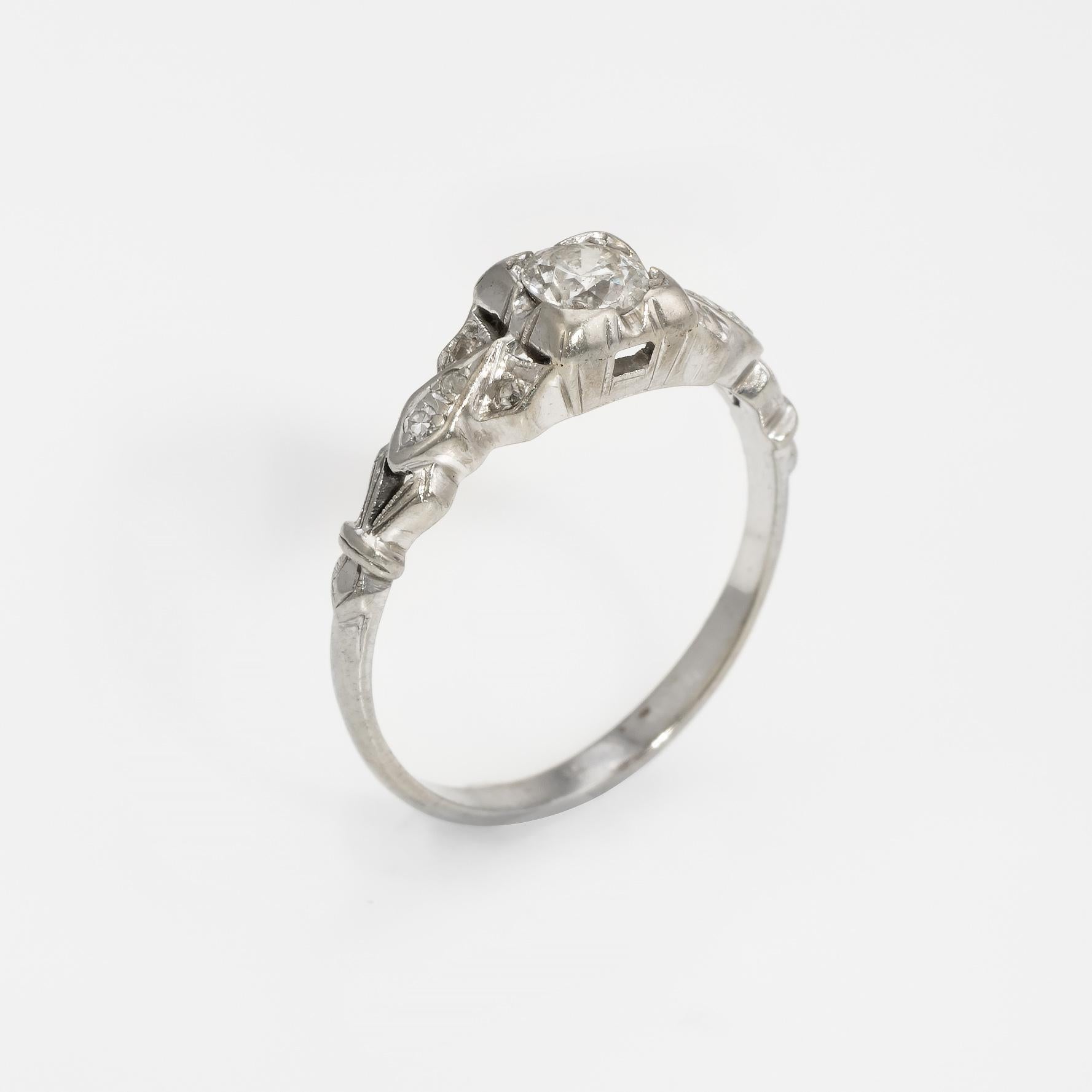 Finely detailed vintage Art Deco era ring (circa 1920s to 1930s), crafted in 14 karat white gold. 

Centrally mounted estimated at 0.30 carat old European cut diamond is accented with an estimated 0.08 carats of single cut diamonds. The total