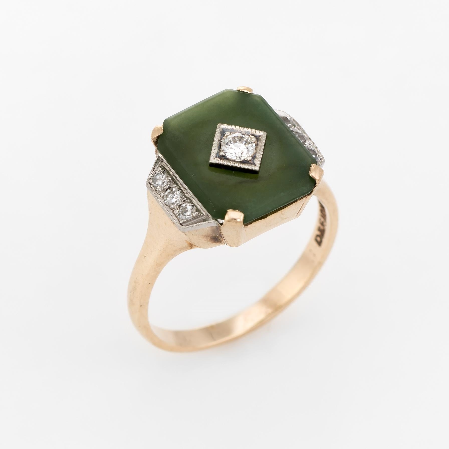 Finely detailed vintage Art Deco era cocktail ring (circa 1920s to 1930s), crafted in 910 karat yellow gold. 

Centrally mounted estimated 0.08 carat old European cut diamond is flanked with a further siz estimated 0.01 carat single cut diamonds.