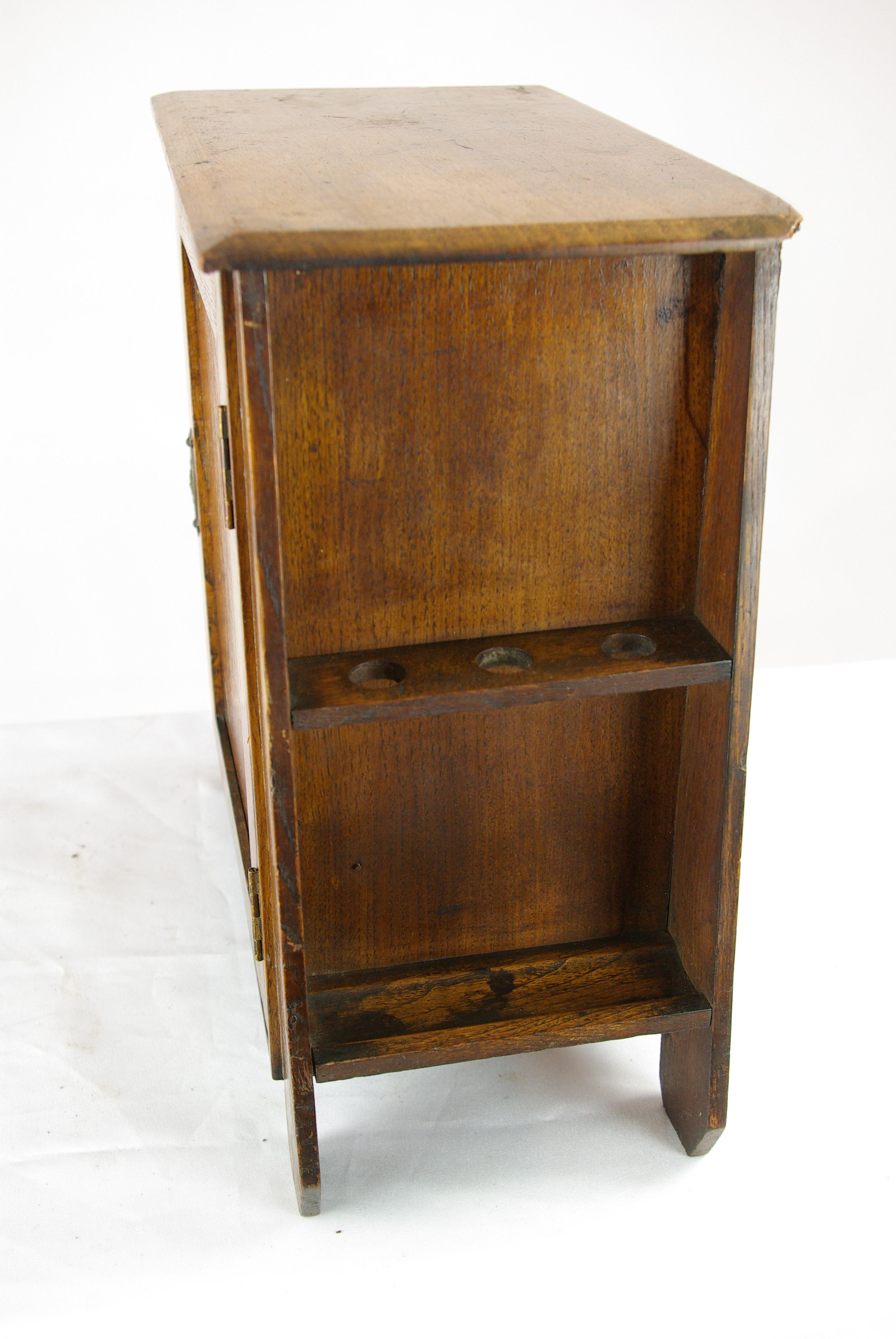 Antique deco smokers cabinet, Art Nouveau cabinet, Glasgow School of Art, Scotland 1900s, B1461.

Scotland 1900s
Molded top above
Single inlaid door below with Art Nouveau floral design
Exterior pipe rack holders to both ends
Opens to reveal two