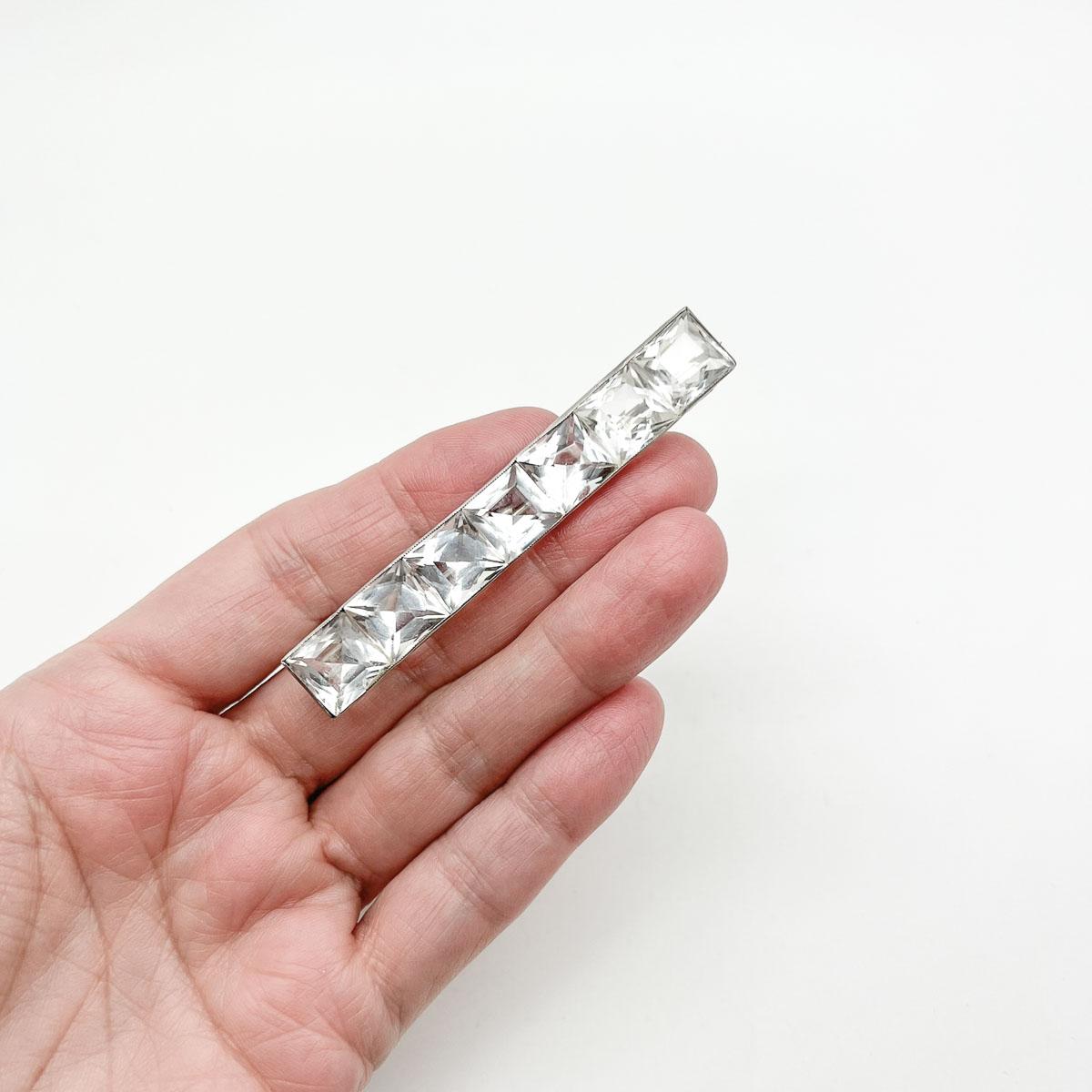 An Antique Deco rock crystal brooch. Synonymous with the Art Deco period, rock crystal remains a coveted art form. The Art Deco geometric design adding to the allure. A perfect pin for a contemporary wardrobe.
An unsigned beauty. A rare treasure.