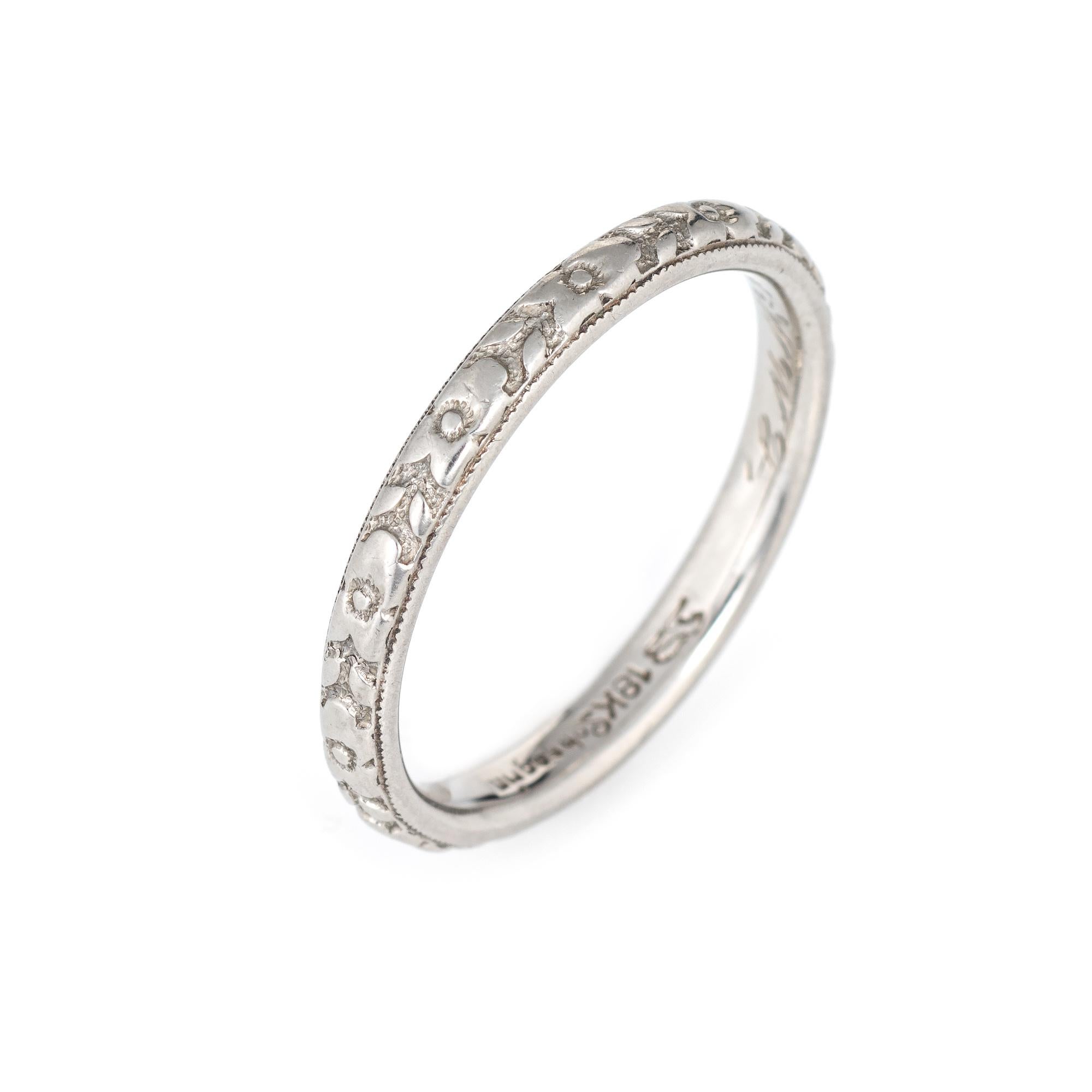 Elegant vintage Art Deco era band (circa 1920s to 1930s) crafted in 18k white gold. 

The ring epitomizes vintage charm and would make a lovely wedding band. Also great worn alone or stacked with your jewelry from any era. The inner band is engraved